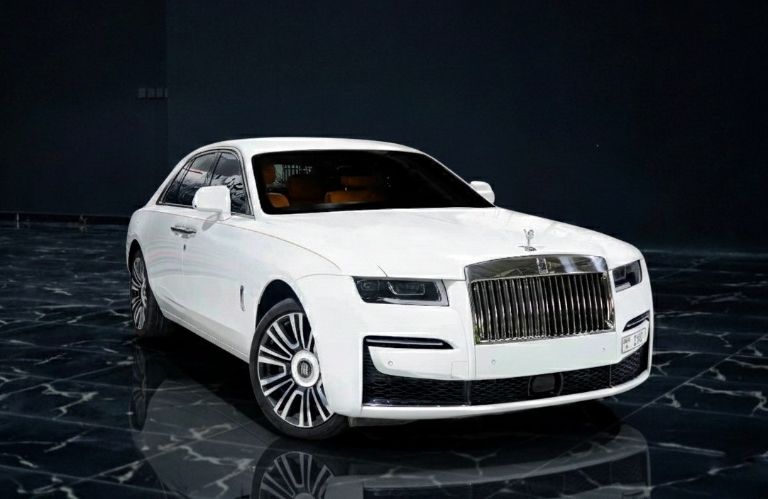 Rolls-Royce Ghost 2023 white luxury sedan front exterior parked in Dubai available for supercar rental