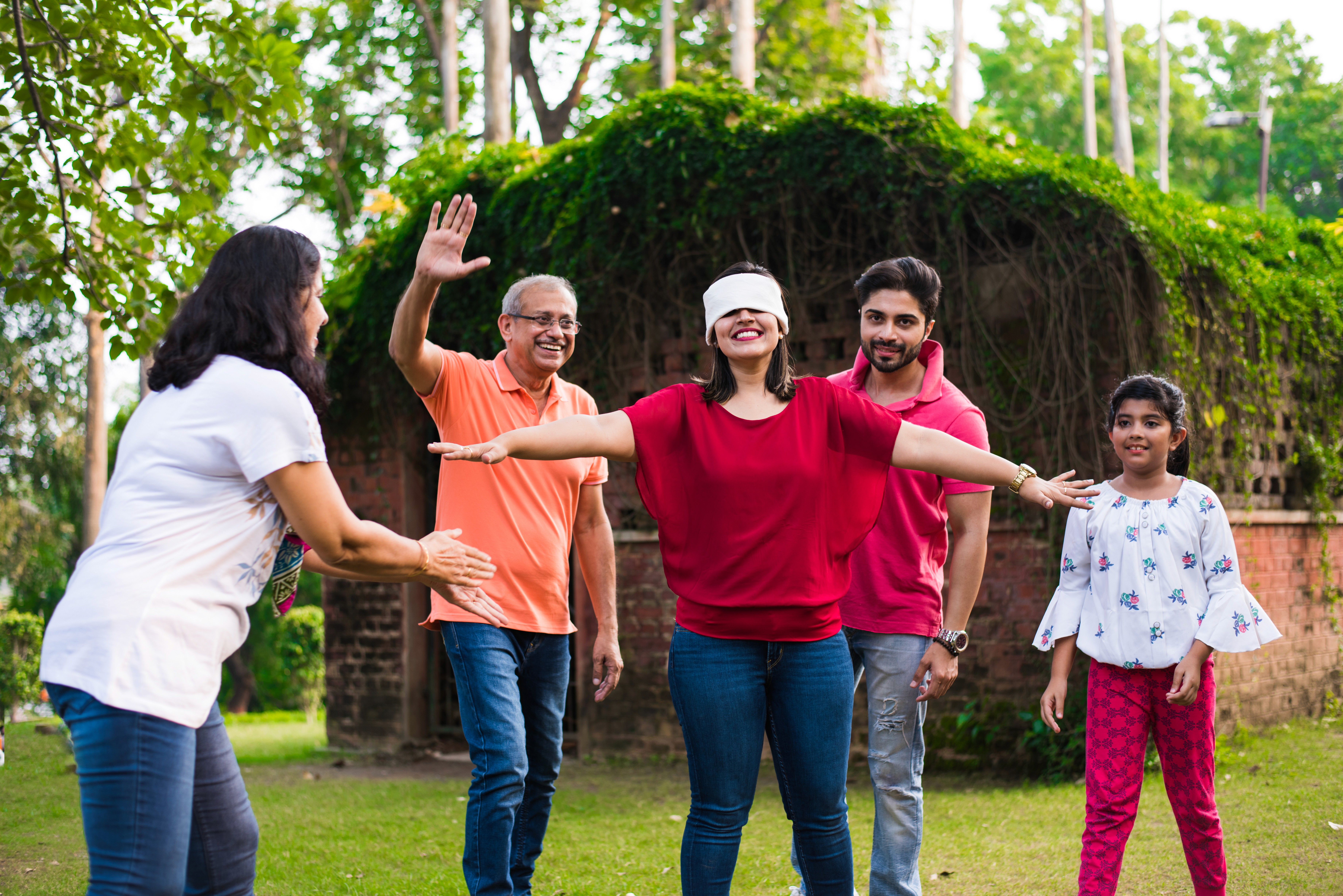 A surreal scene of blurred figures walking on a reflective surface, with a glowing horizontal light streak under a hazy sky.