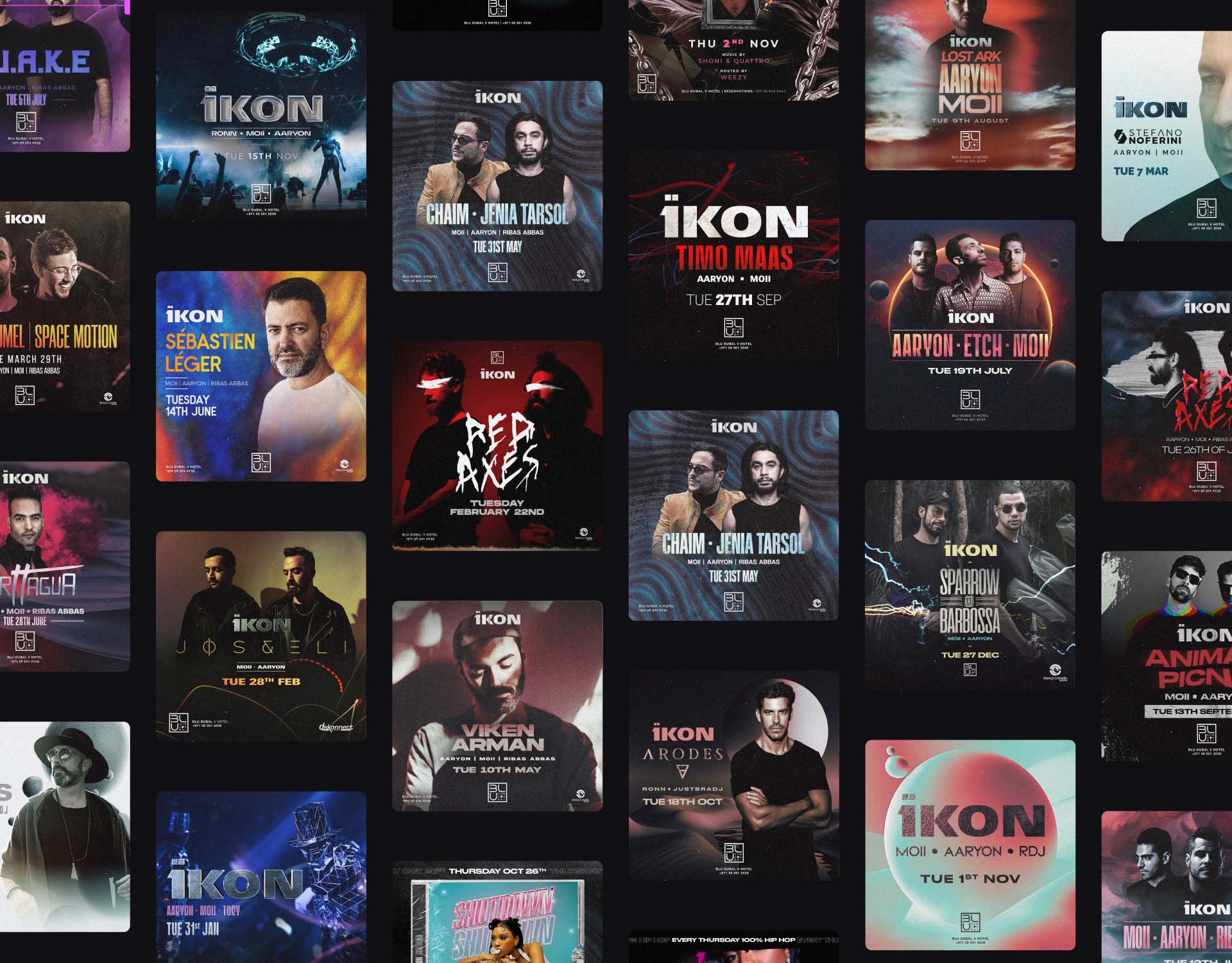 man wearing grey t-shirt standing in front of man sitting on chair