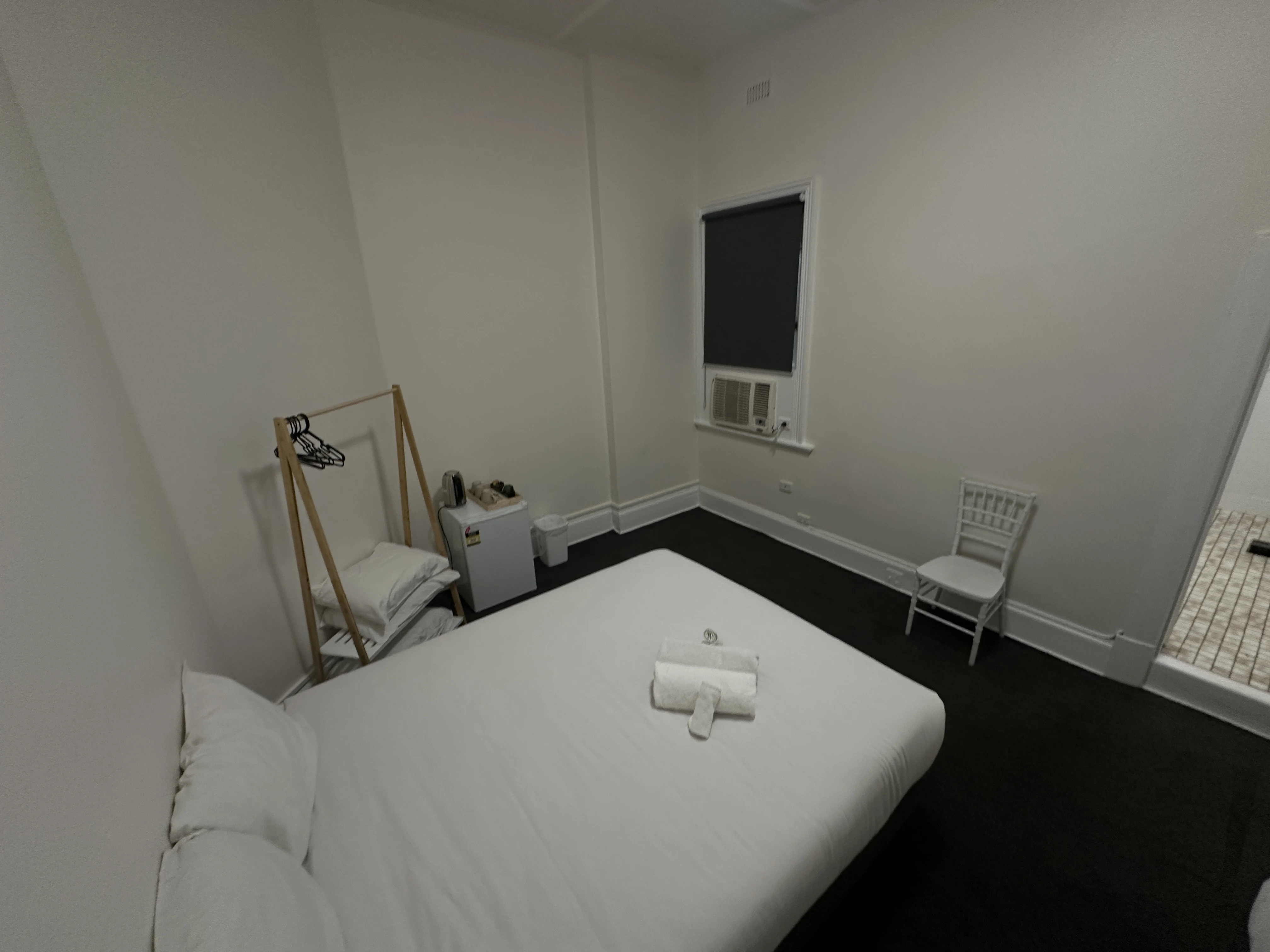 Blockout blind in hotel room creating a dark, comfortable sleeping environment