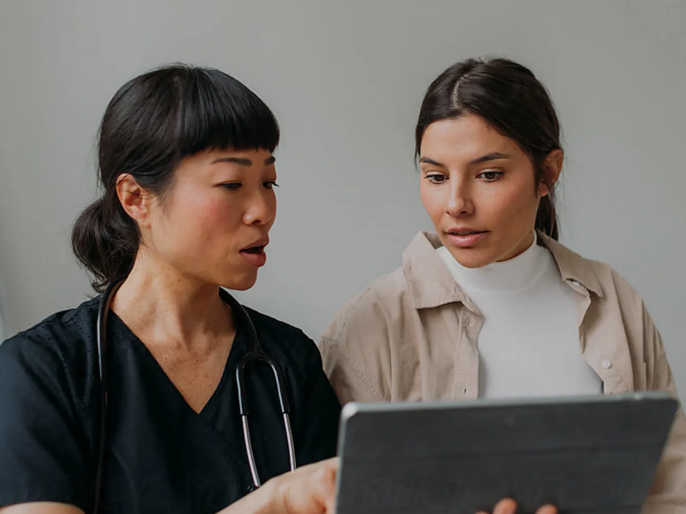 Two people running in a field