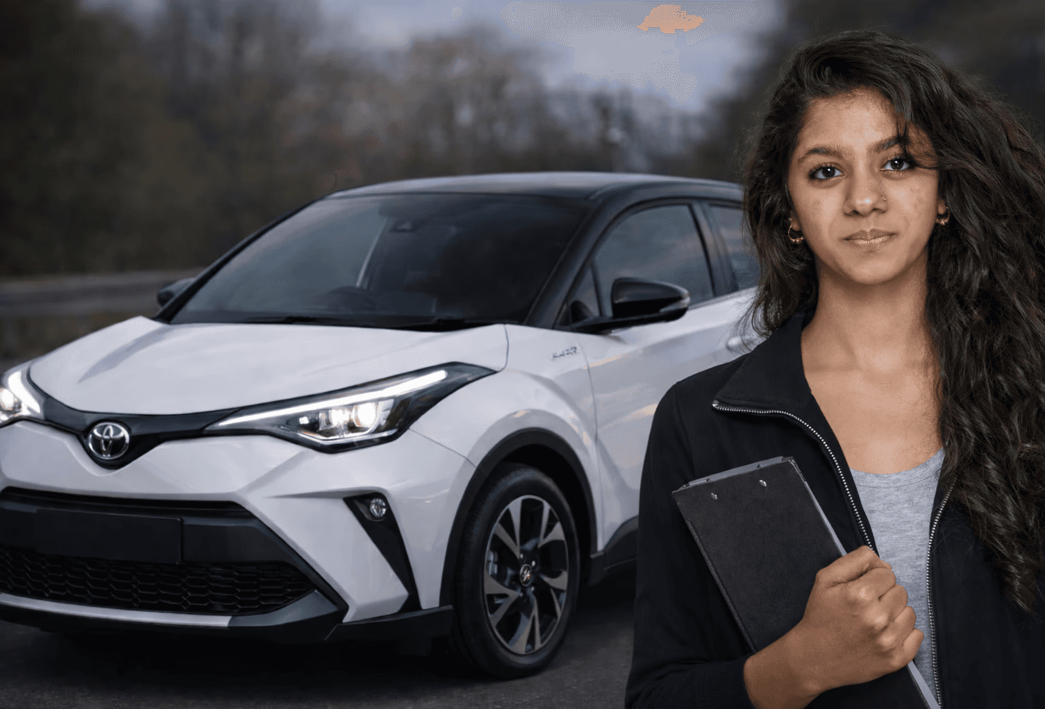 Auto-Learners driving instructor explaining a lesson to a learner beside a car