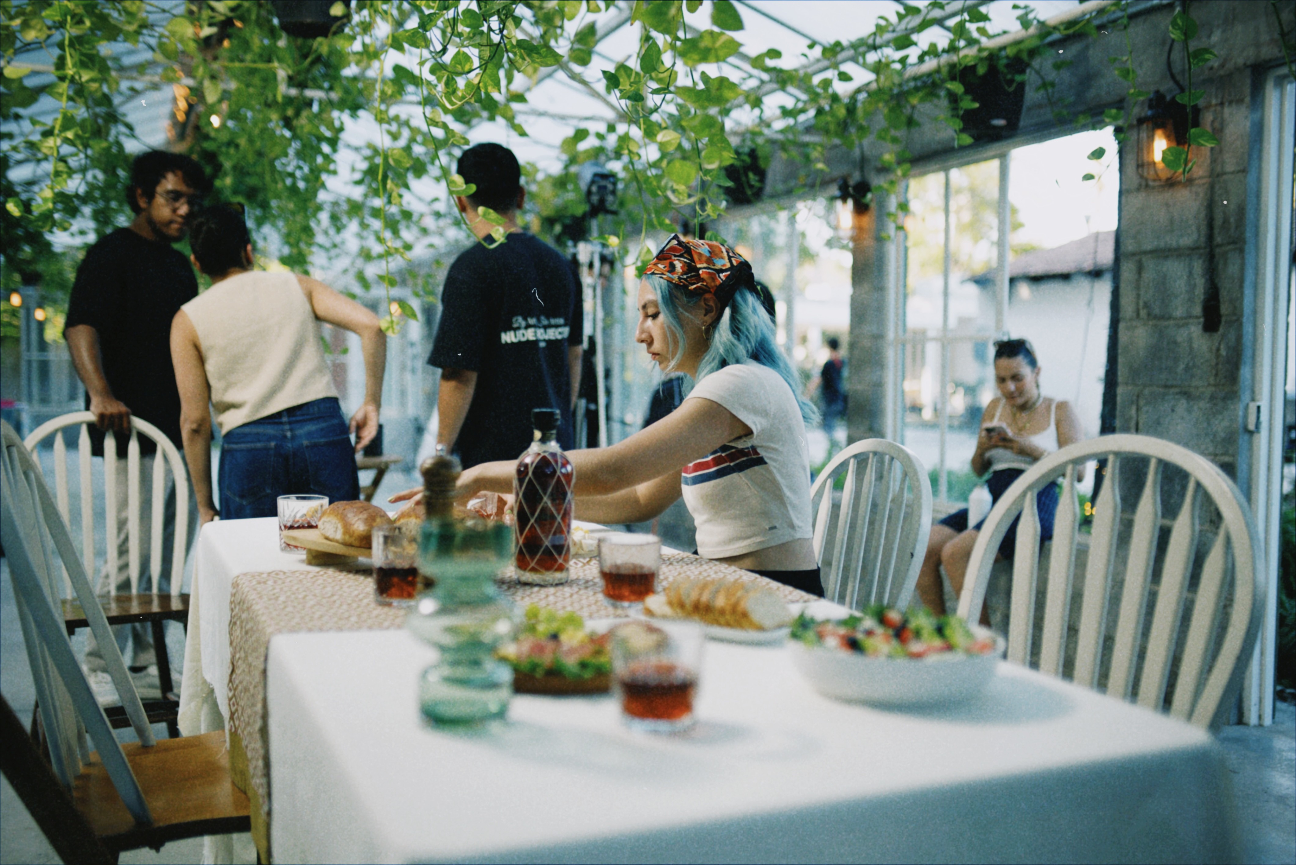 The collaborative crew of Antimateria Films on the set of Vinoteca, building a sanctuary for seekers of the cinematic soul