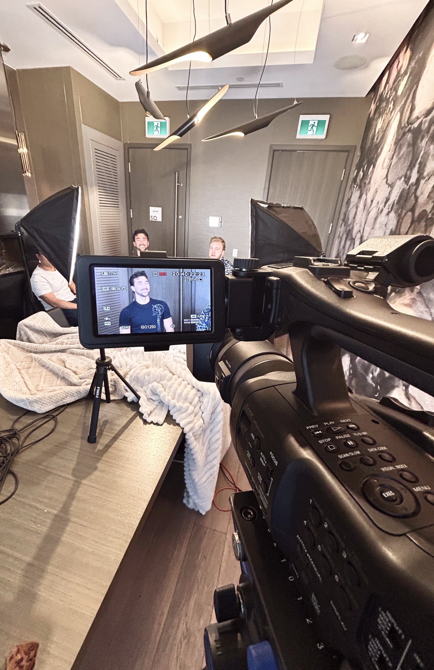 two women sitting at a table working on a laptop