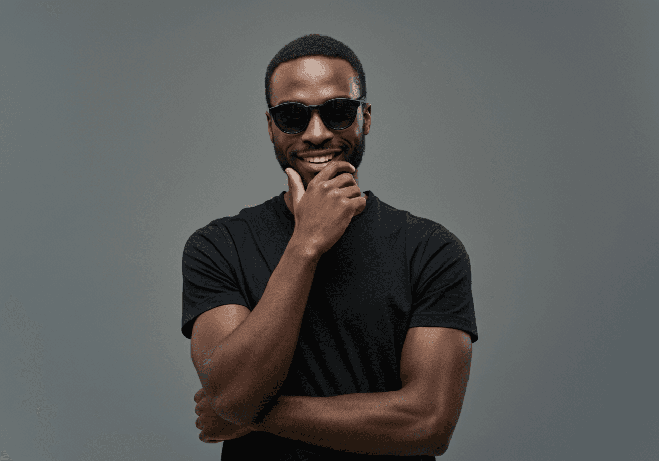 Portrait shot of a man wearing black sunglasses.