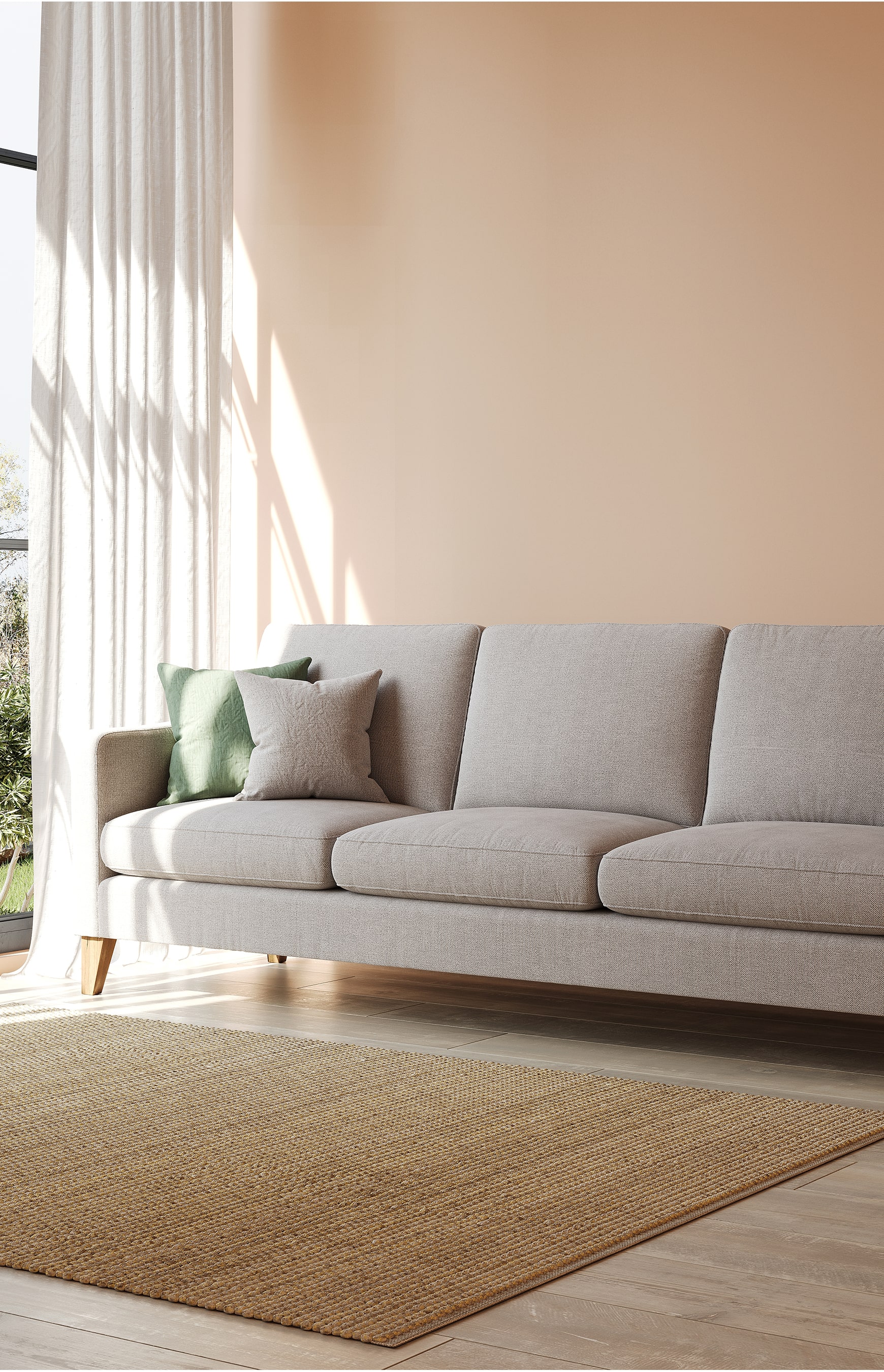 Modern living room with fabric sofa, cushions, and soft natural lighting