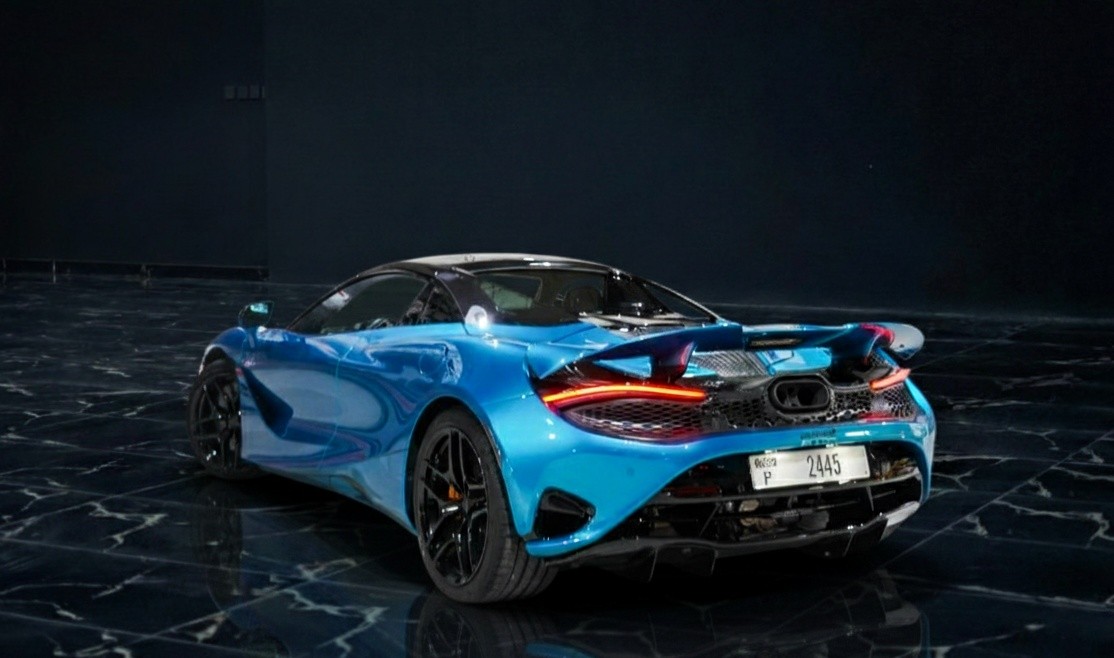 Rear view of McLaren 750S Spider showcasing open-top design and performance styling at Queen of Supercar Rental.