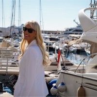 Natural rock arch framing desert landscape at sunset