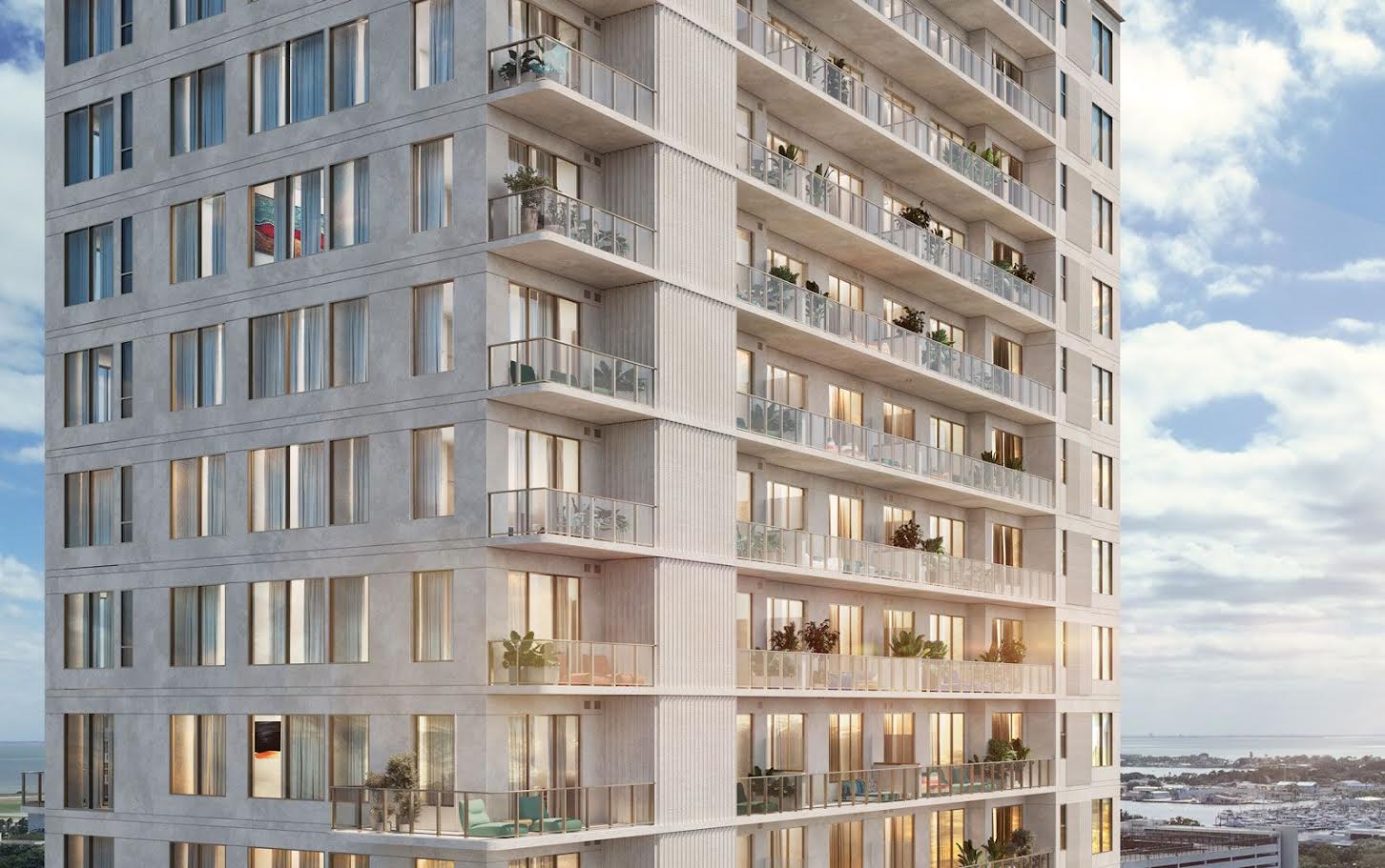 Close-up architectural rendering of the Roche Bobois St. Pete Tower facade showing balconies, floor-to-ceiling windows, and views of downtown St. Petersburg and Tampa Bay