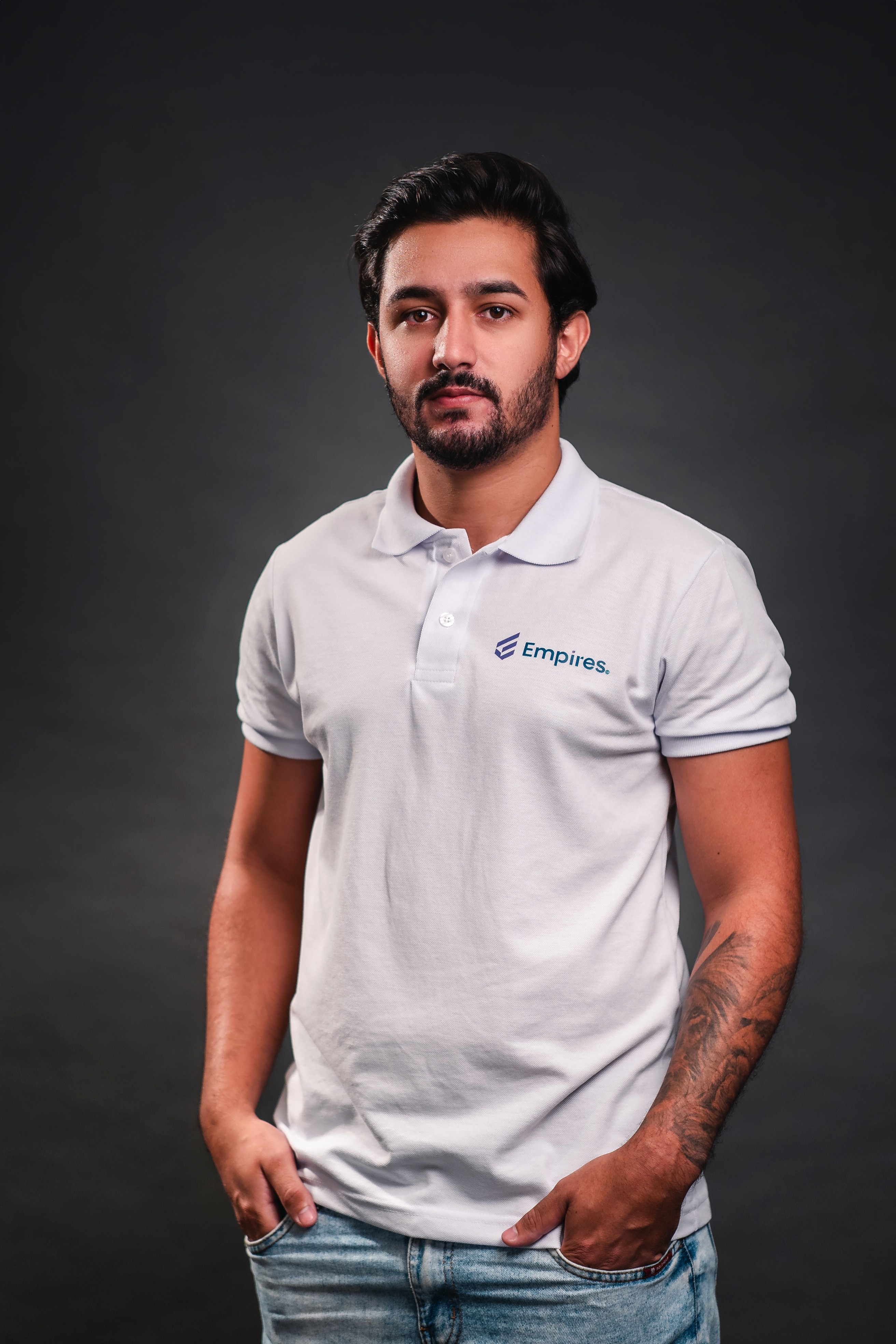 woman in black crew neck t-shirt wearing brown framed eyeglasses standing on rocky shore during