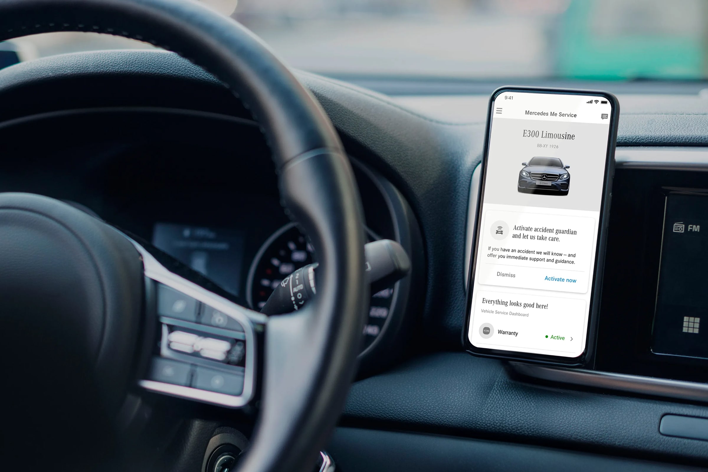 Mercedes-Benz service app showing vehicle maintenance, safety features, and warranty status on mobile device