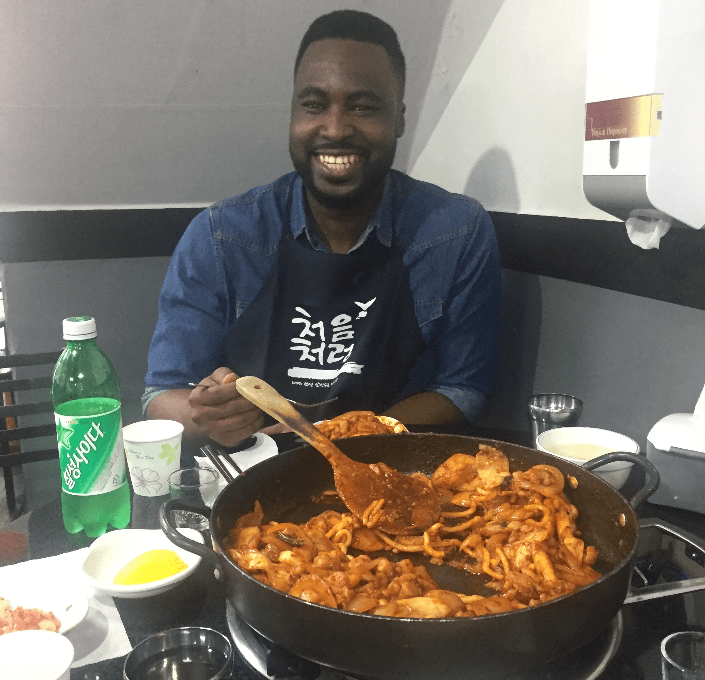 man smiling while eating