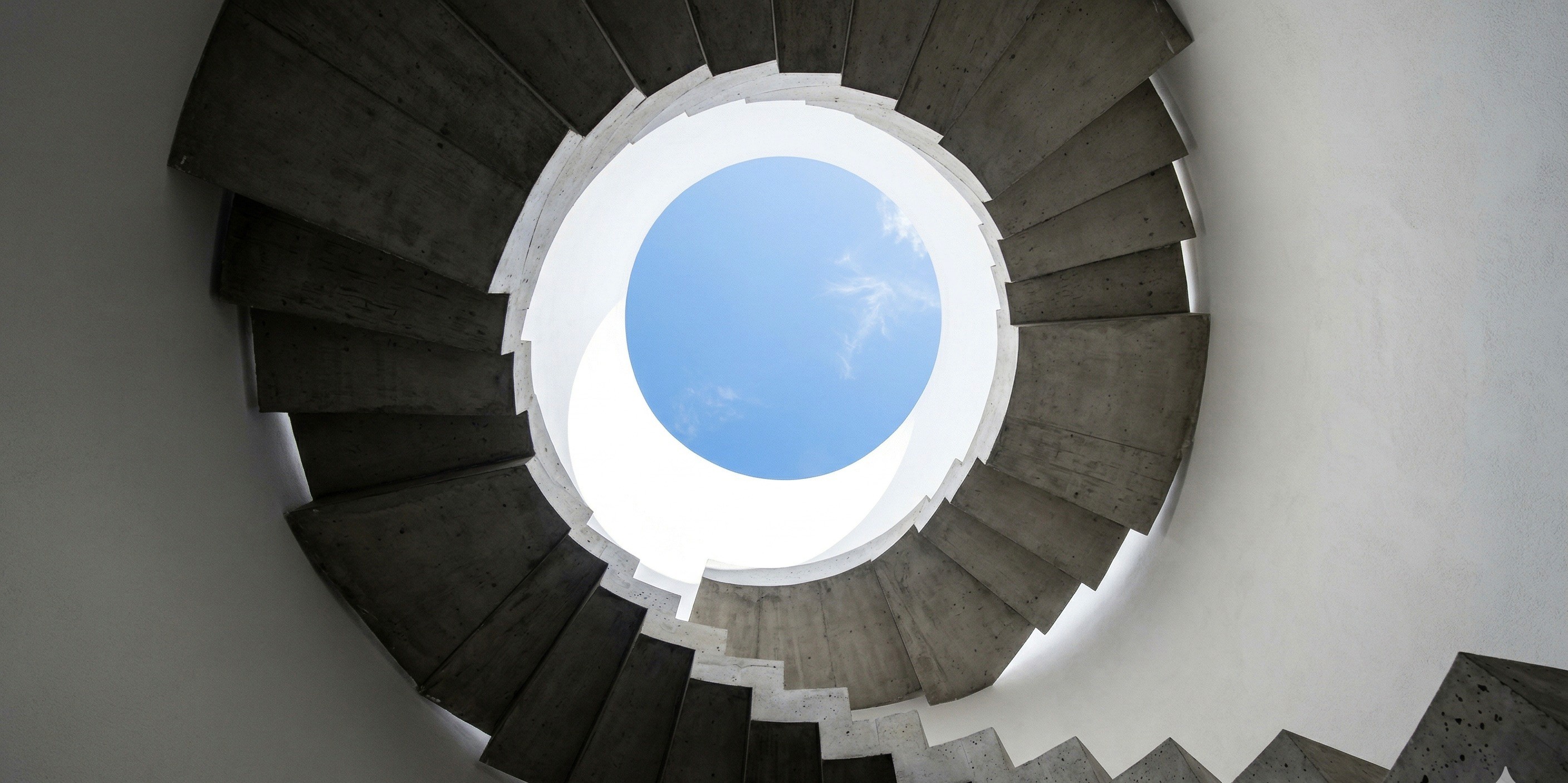 a gray couch with four pillows on it