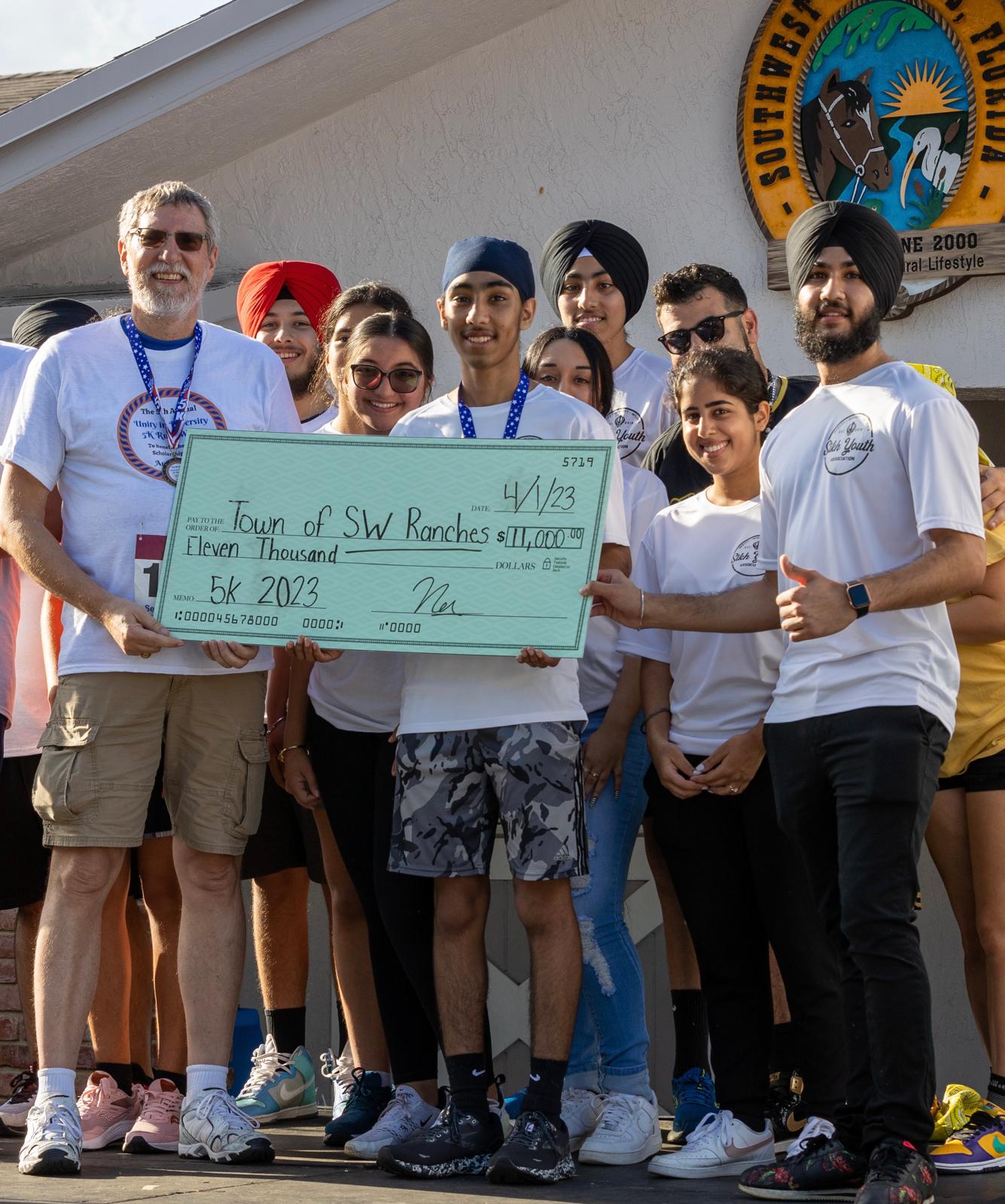 a group of people walking on a sidewalk