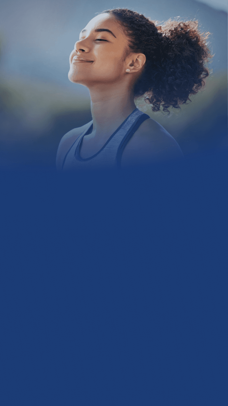 Professional nurse providing mobility assistance to an elderly patient in a bright healthcare setting.