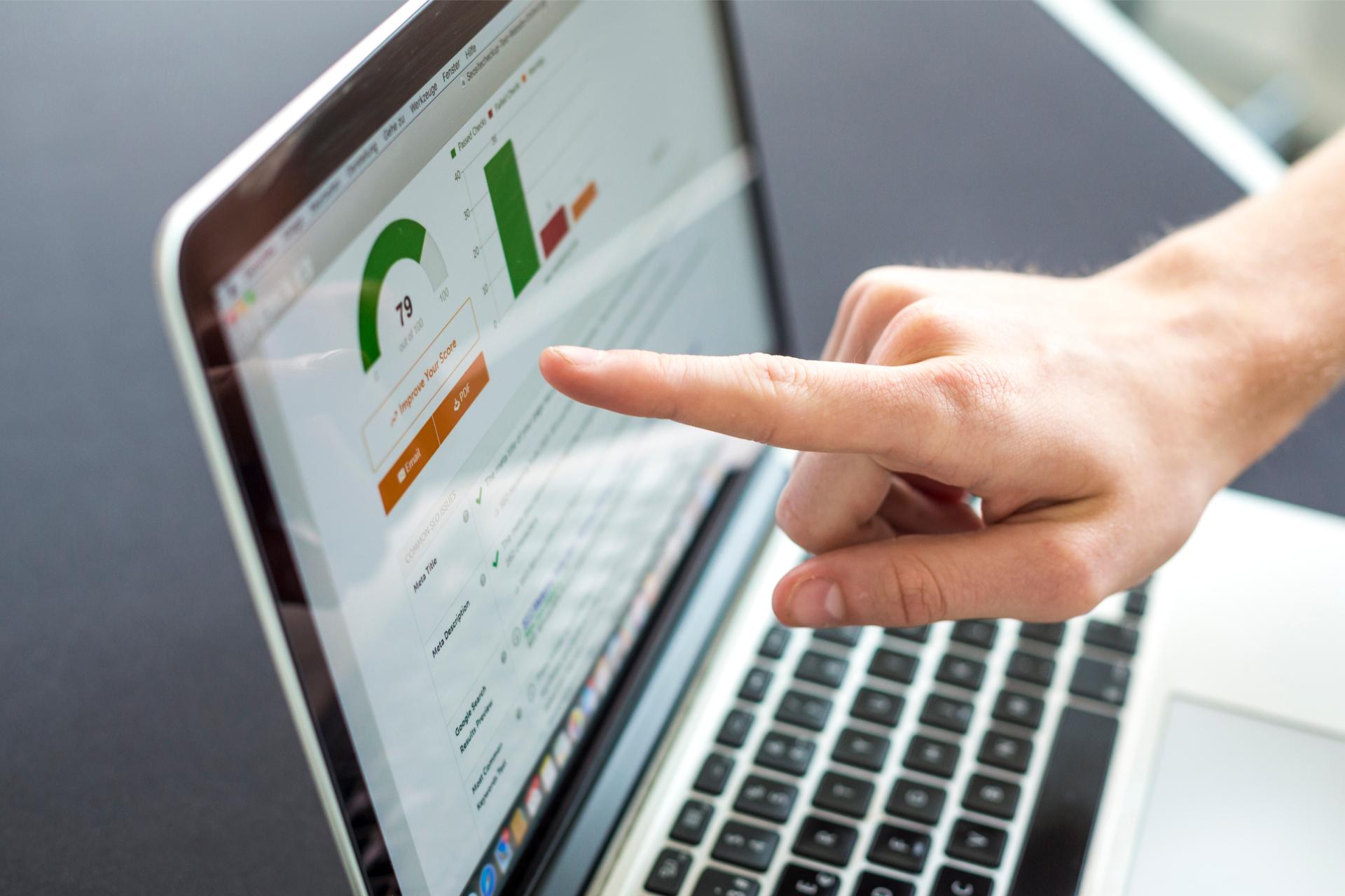 Accounting on a laptop close up of screen with hand