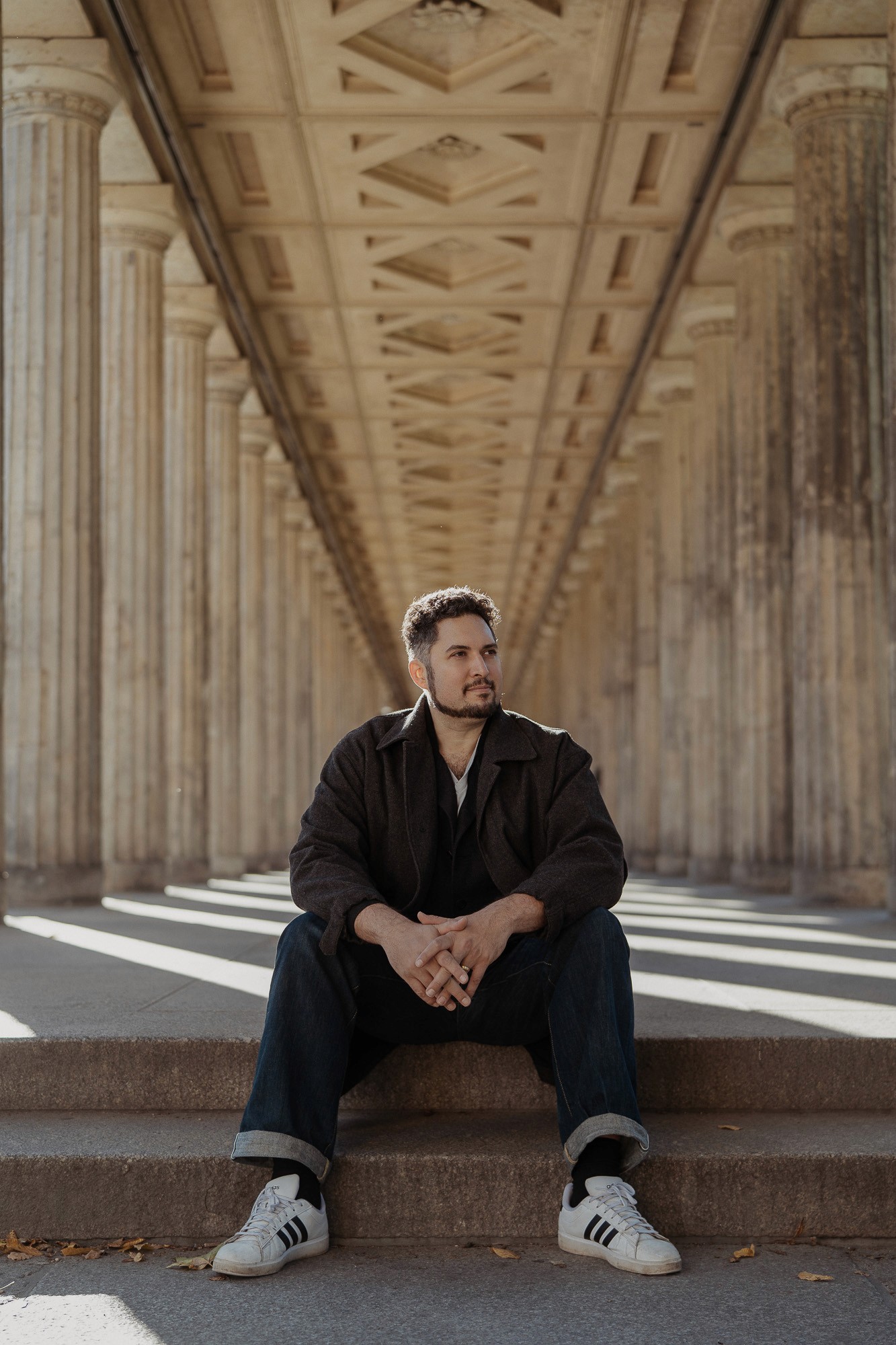 Portrait of StoryOS founder in a structured architectural setting representing brand alignment and clarity