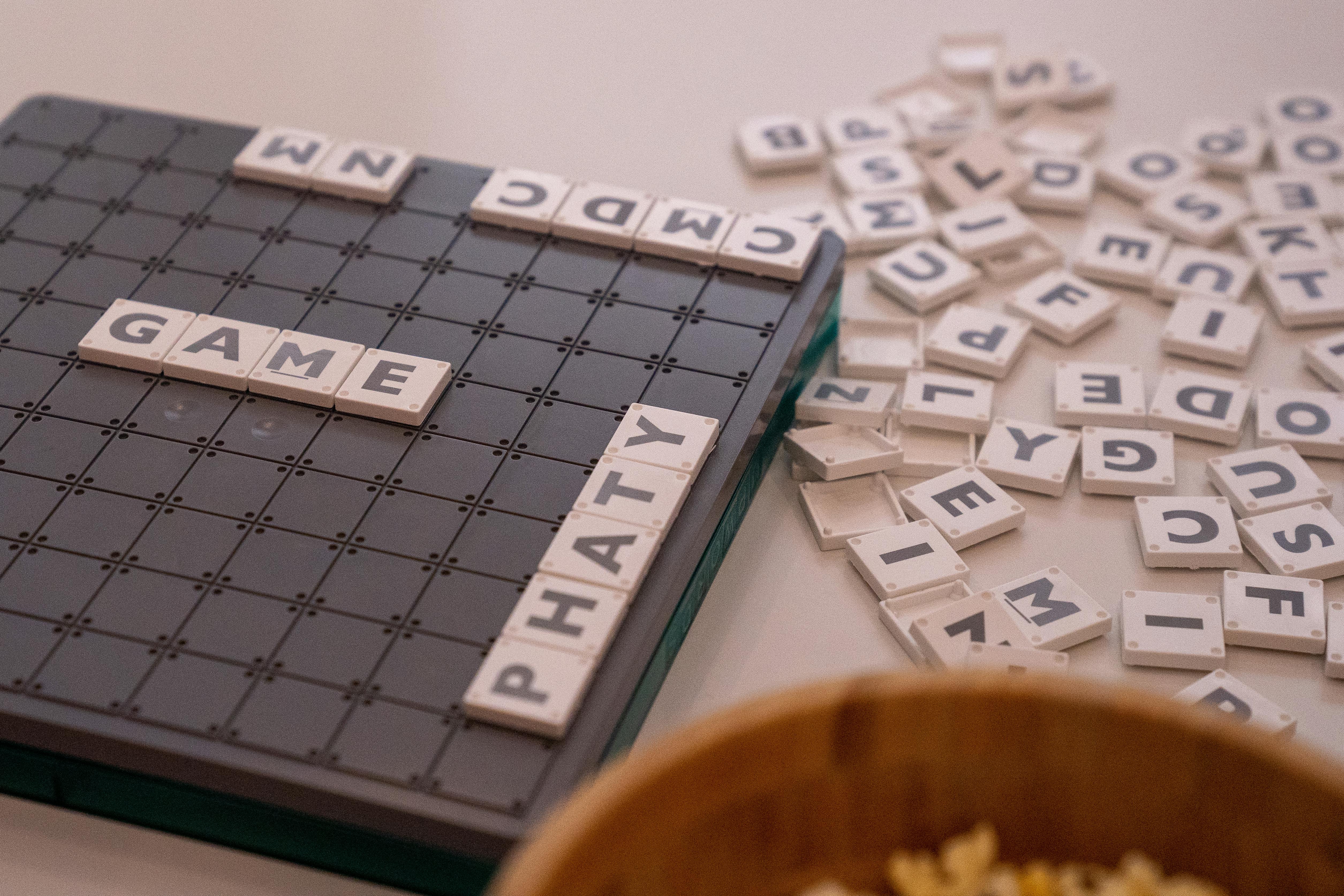 White Scrabble Tiles on a Board
