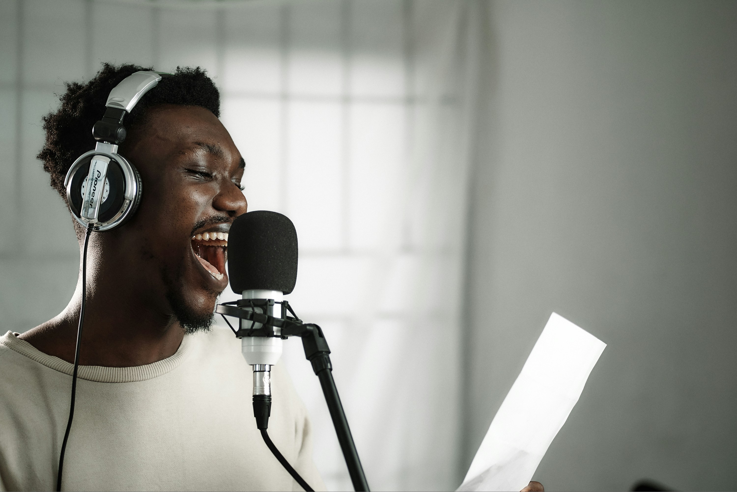 singer singing into microphone