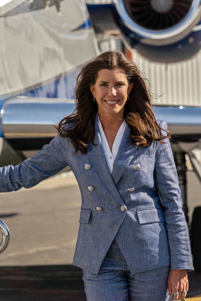 person sitting in a chair in front of a man