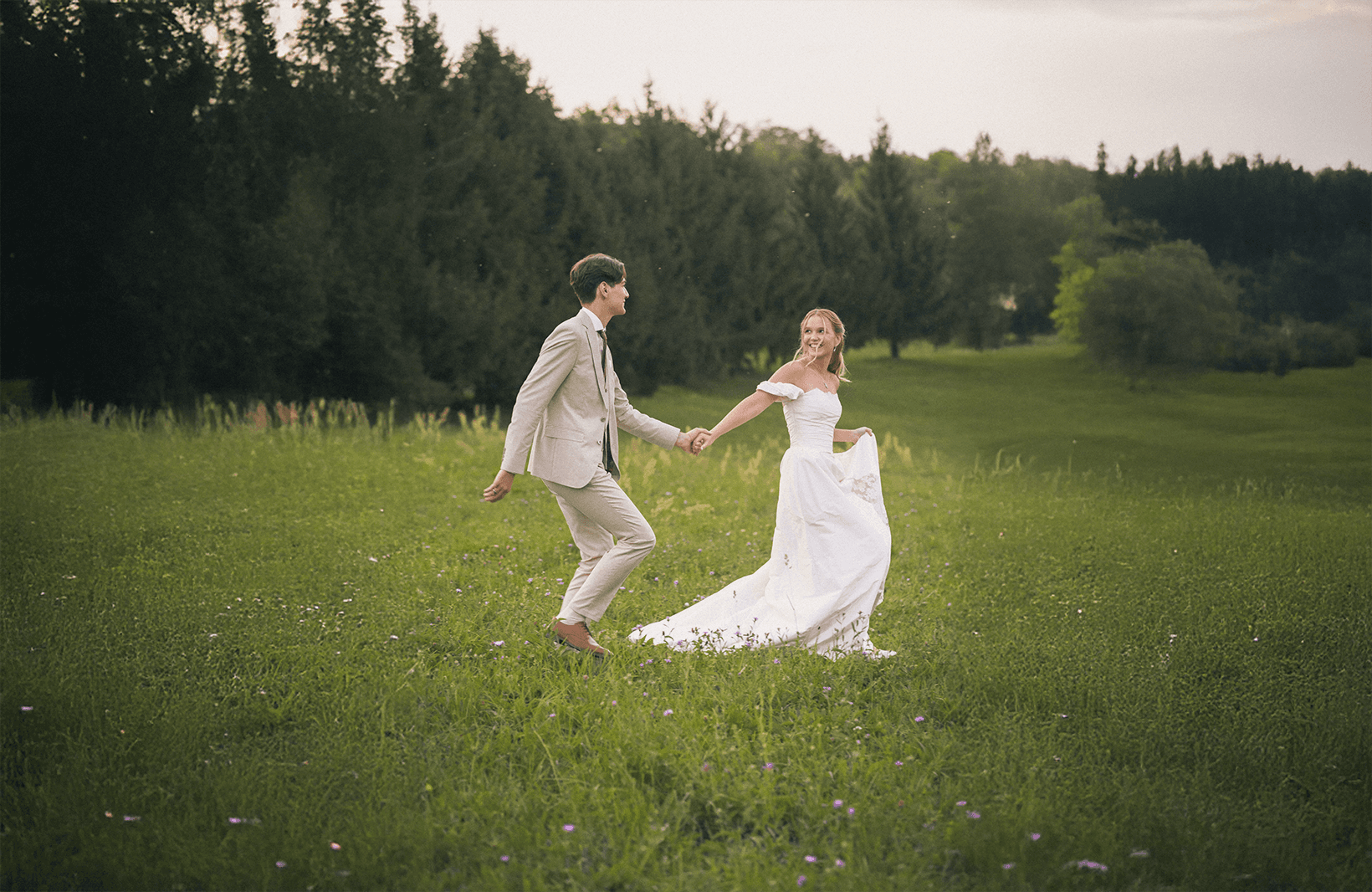 man and woman kissing on brown grass field during daytime