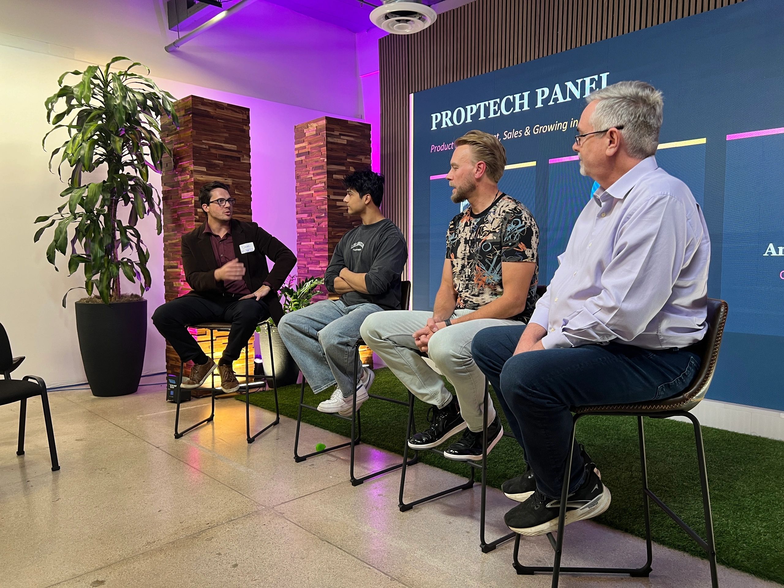 a black and white living room with a large tv