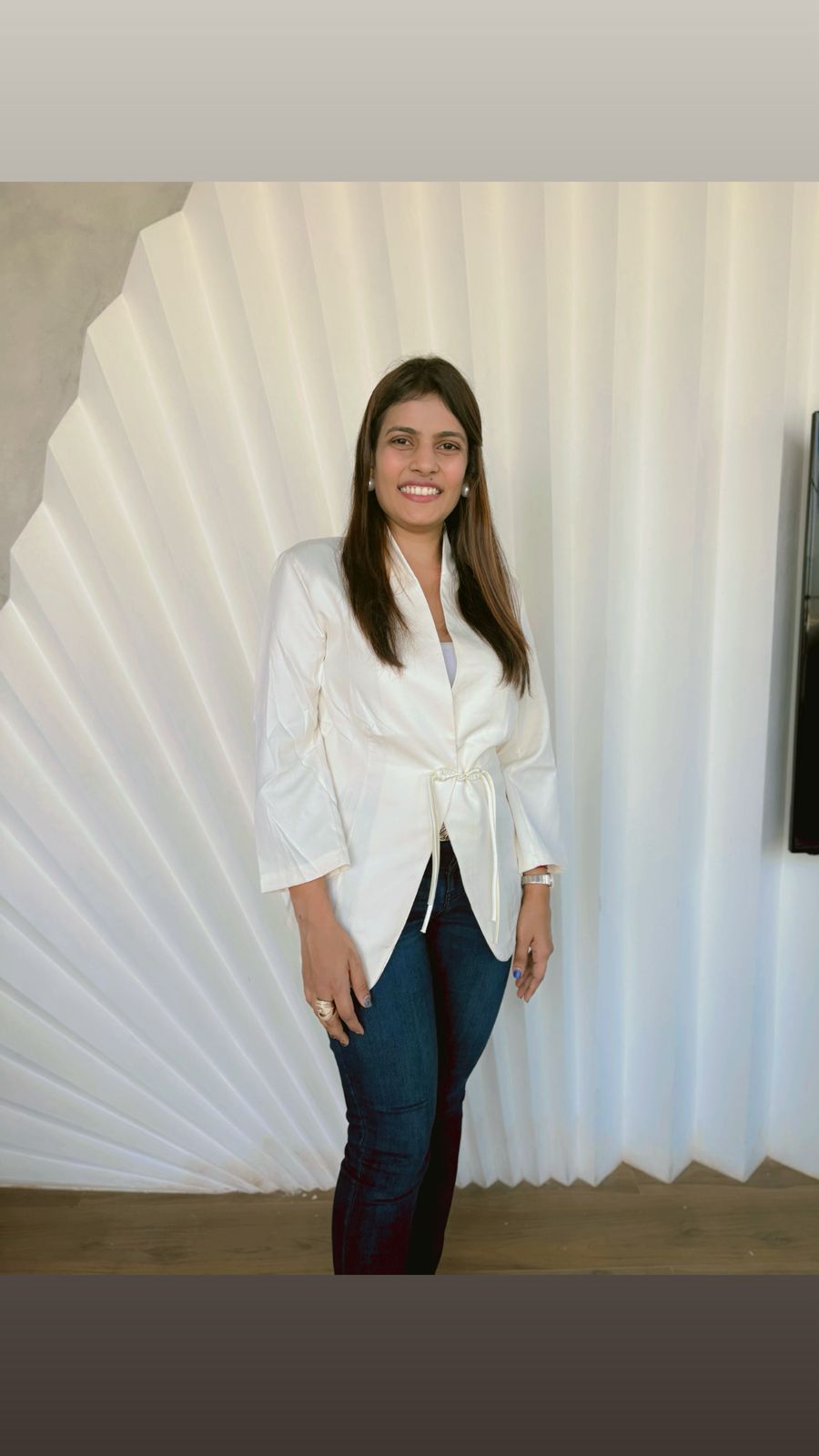 a black and white living room with a large tv
