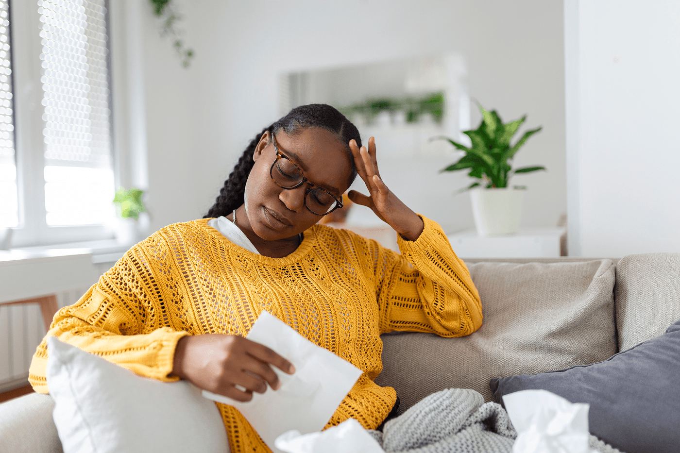 Woman in yellow reading paper