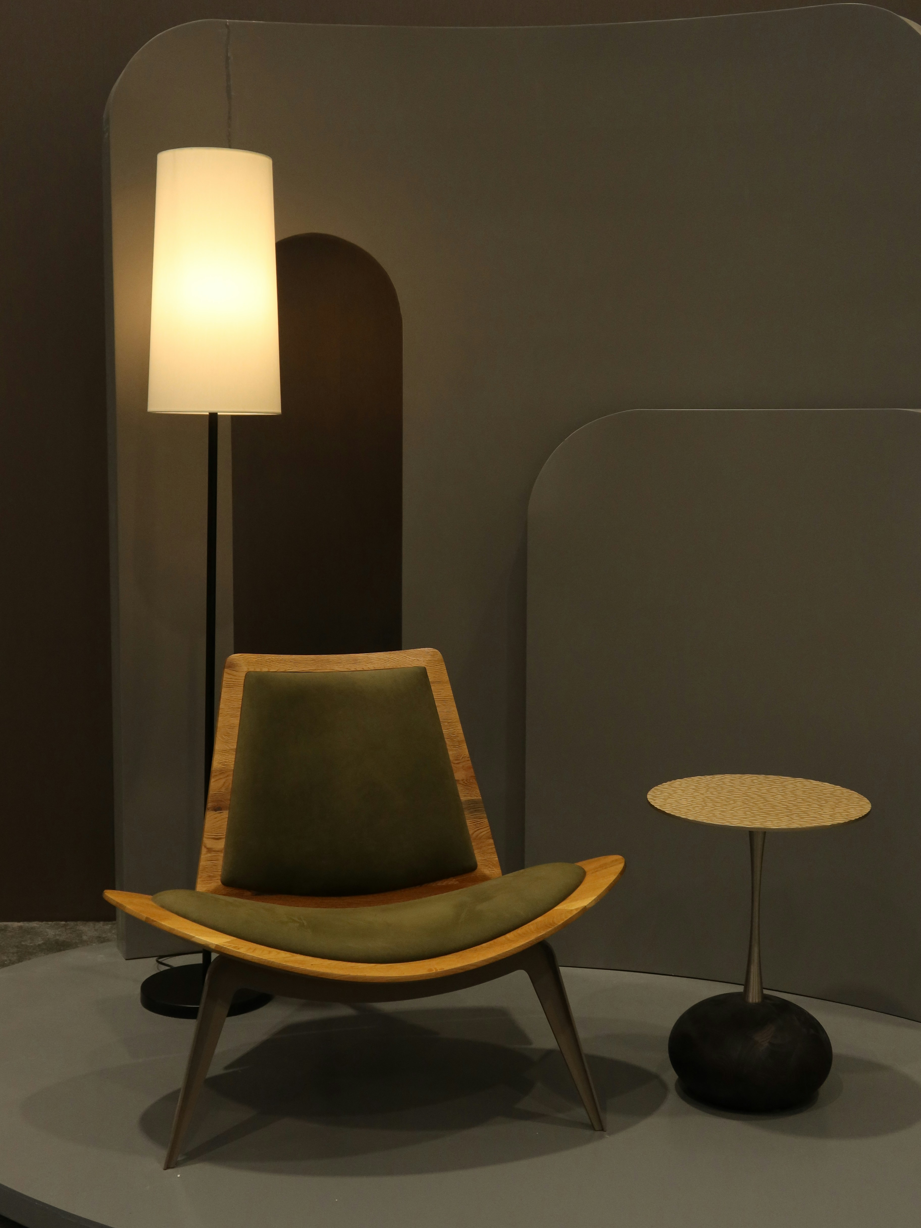 brown wooden chair with white table lamp