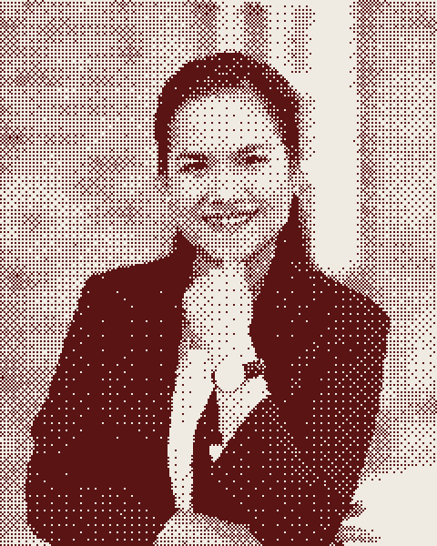 woman in black blazer smiling