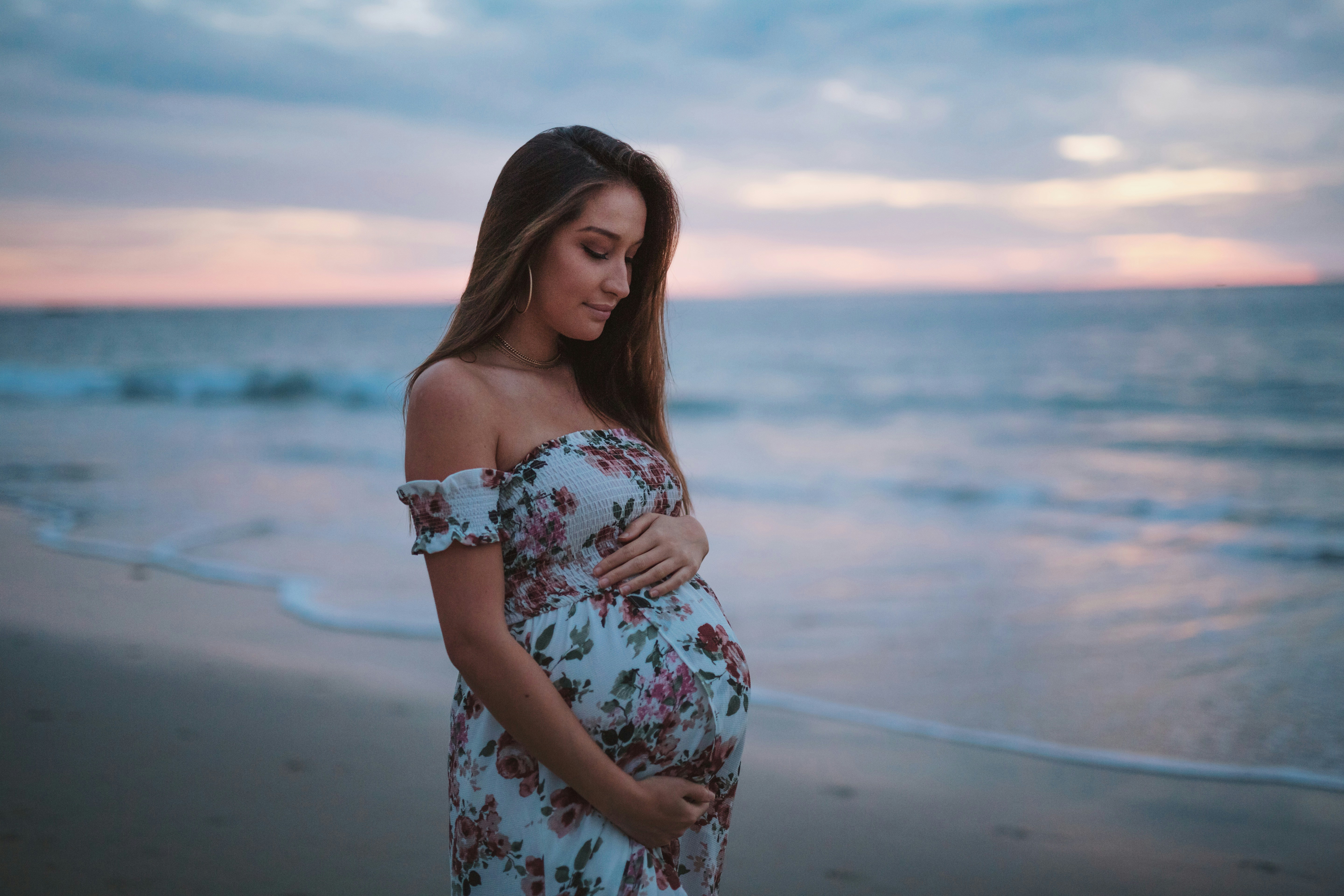 woman in a cute dress - Fall Pregnancy Outfits