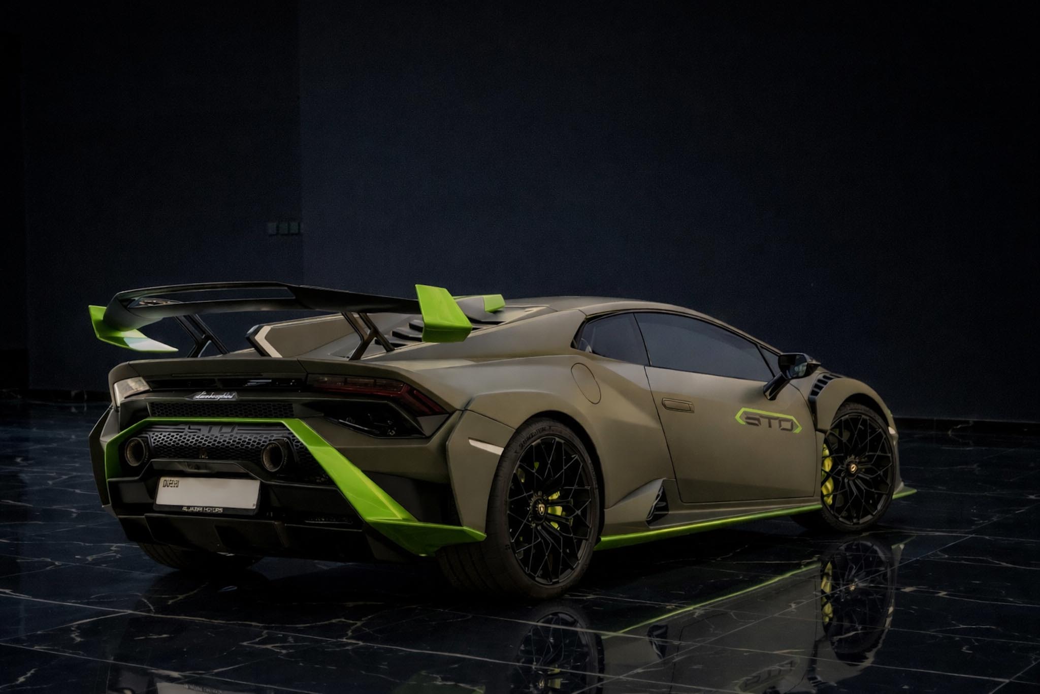 Lamborghini Huracán STO 2022 green rear three quarter exterior by Queen of Supercar Rental Dubai