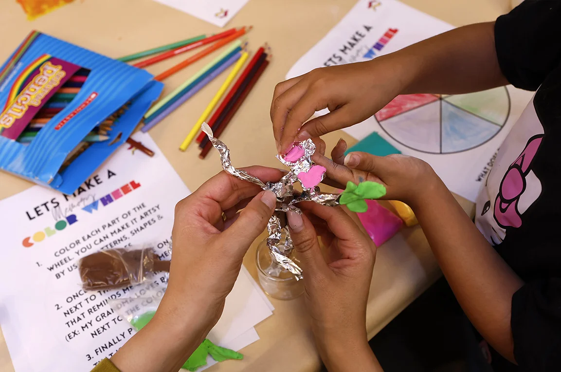 Children making art with foil