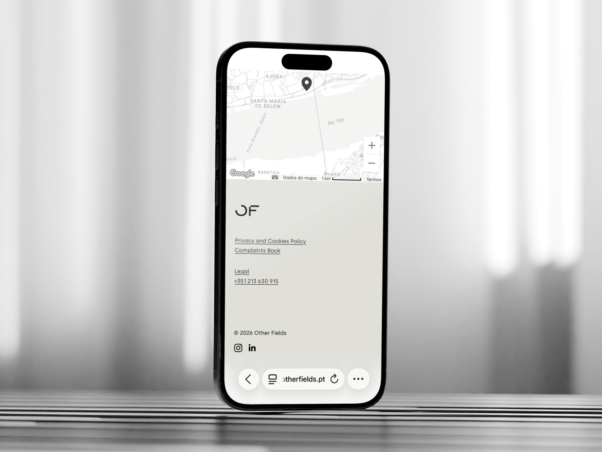 an image showing an architecture company's website on an iphone