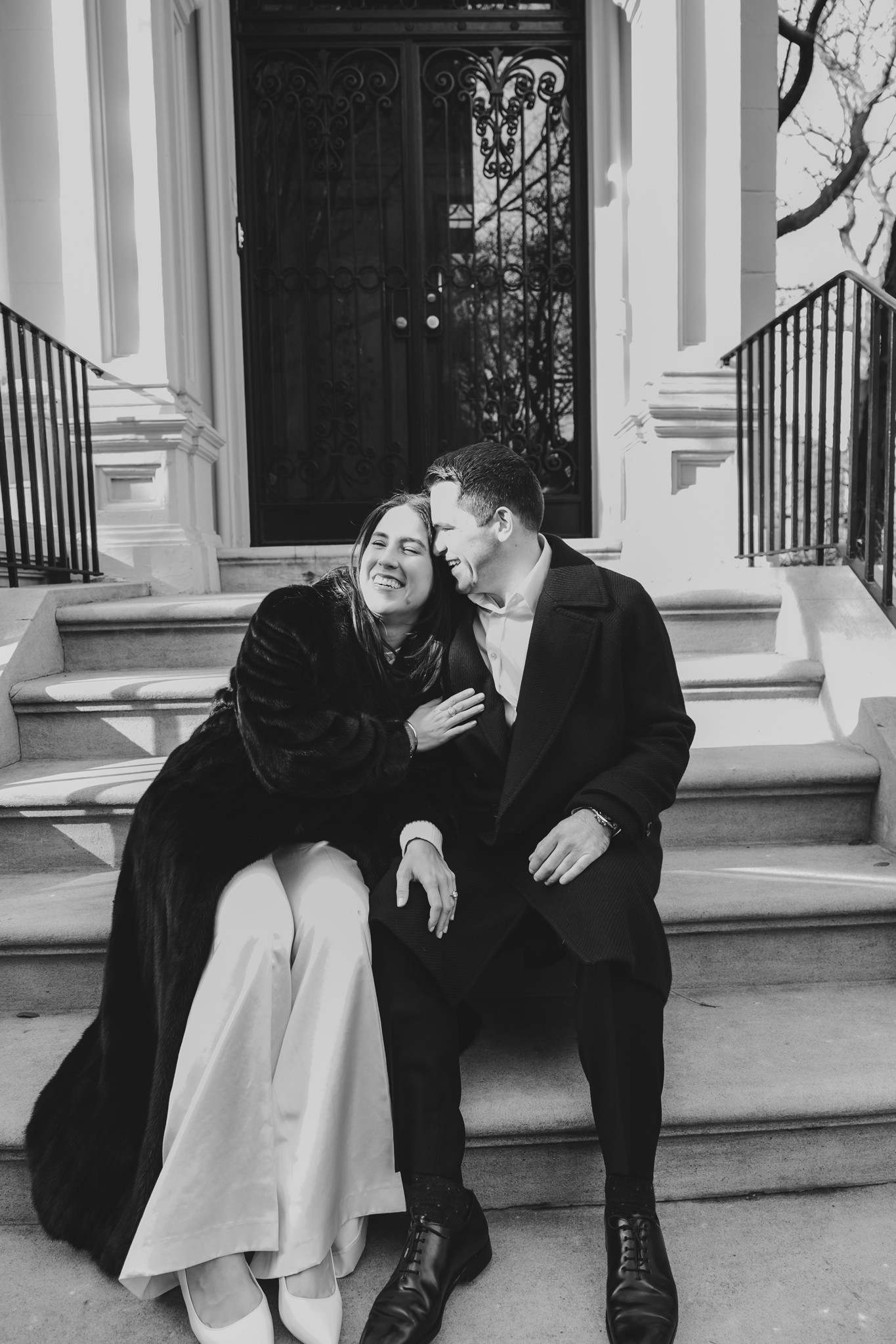 couple-sitting-on-brownstone-stoop-portrait-new-york-city