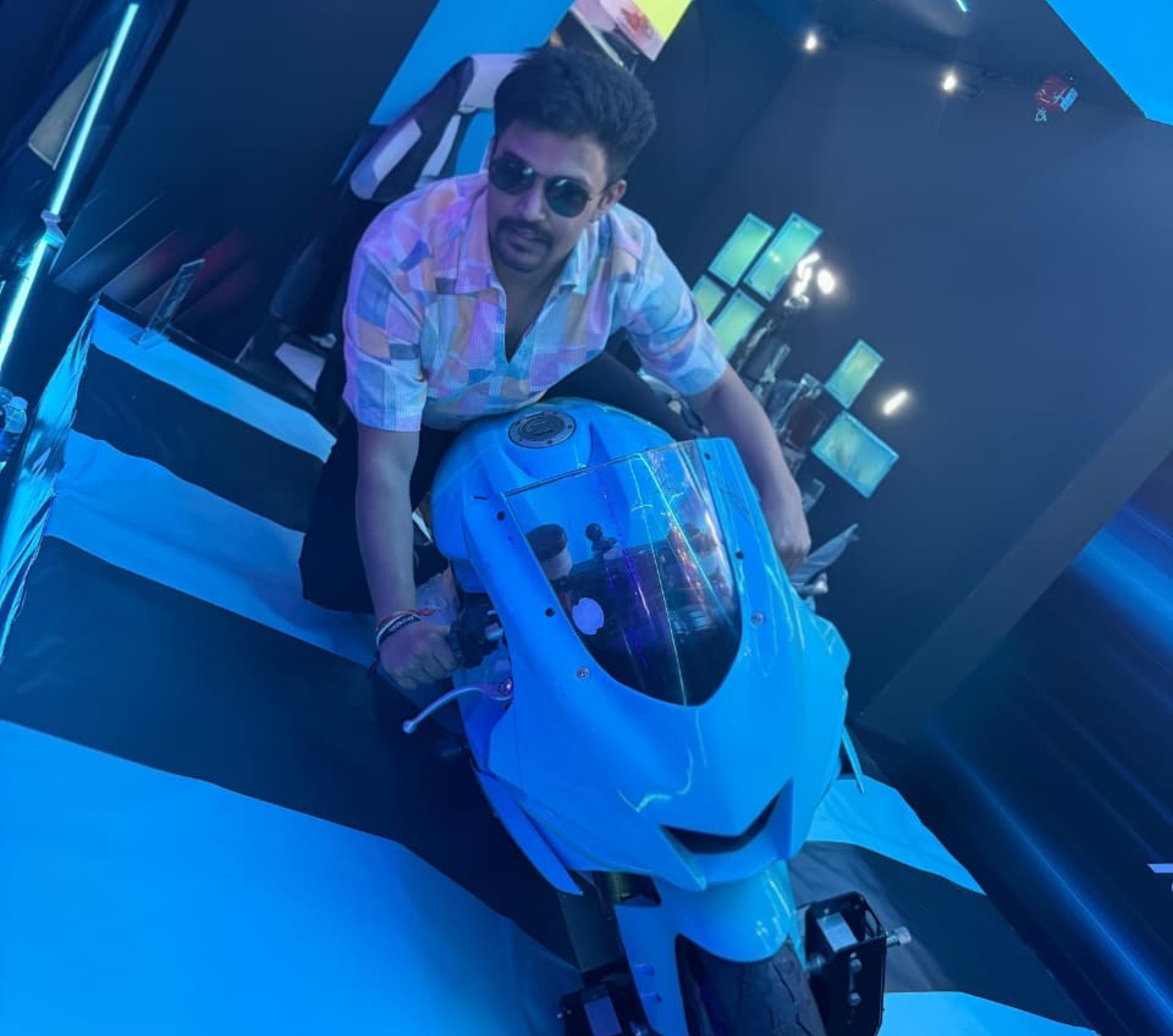 man filming on beach