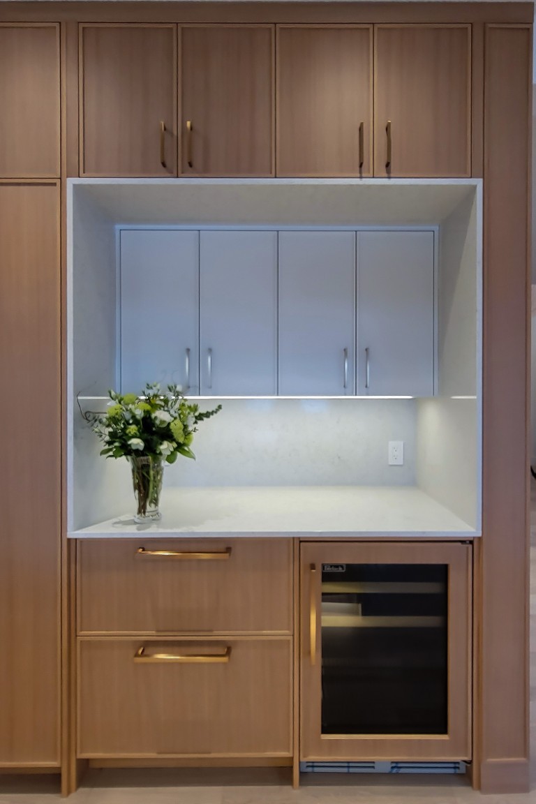 Image of KHD Homes kitchen design with cabinetry, wine fridge, and layout design elements for home renovations.
