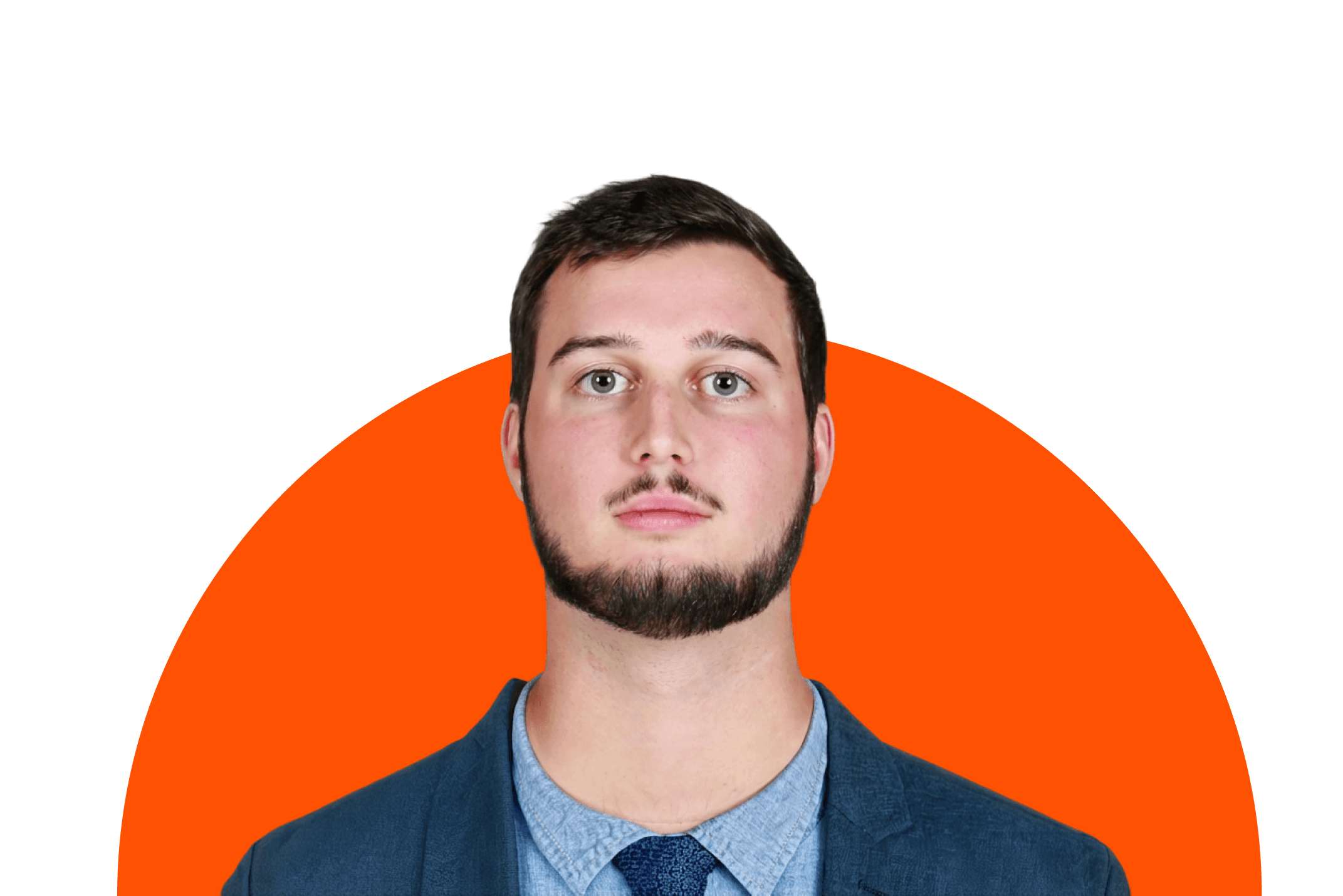 A person in a suit posing for a professional headshot