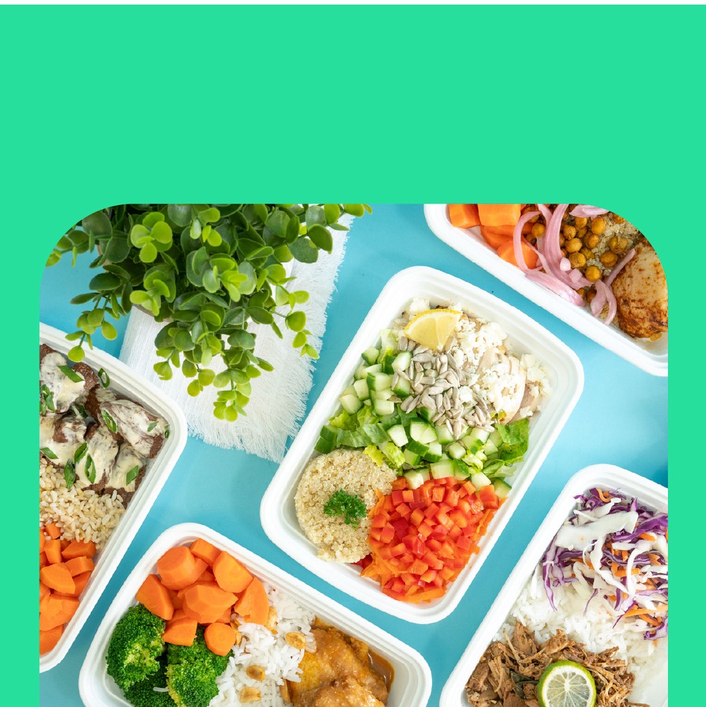 Top down image of tabel filled with a variety of different meals