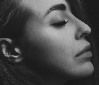 grayscale photography of woman facing sideways