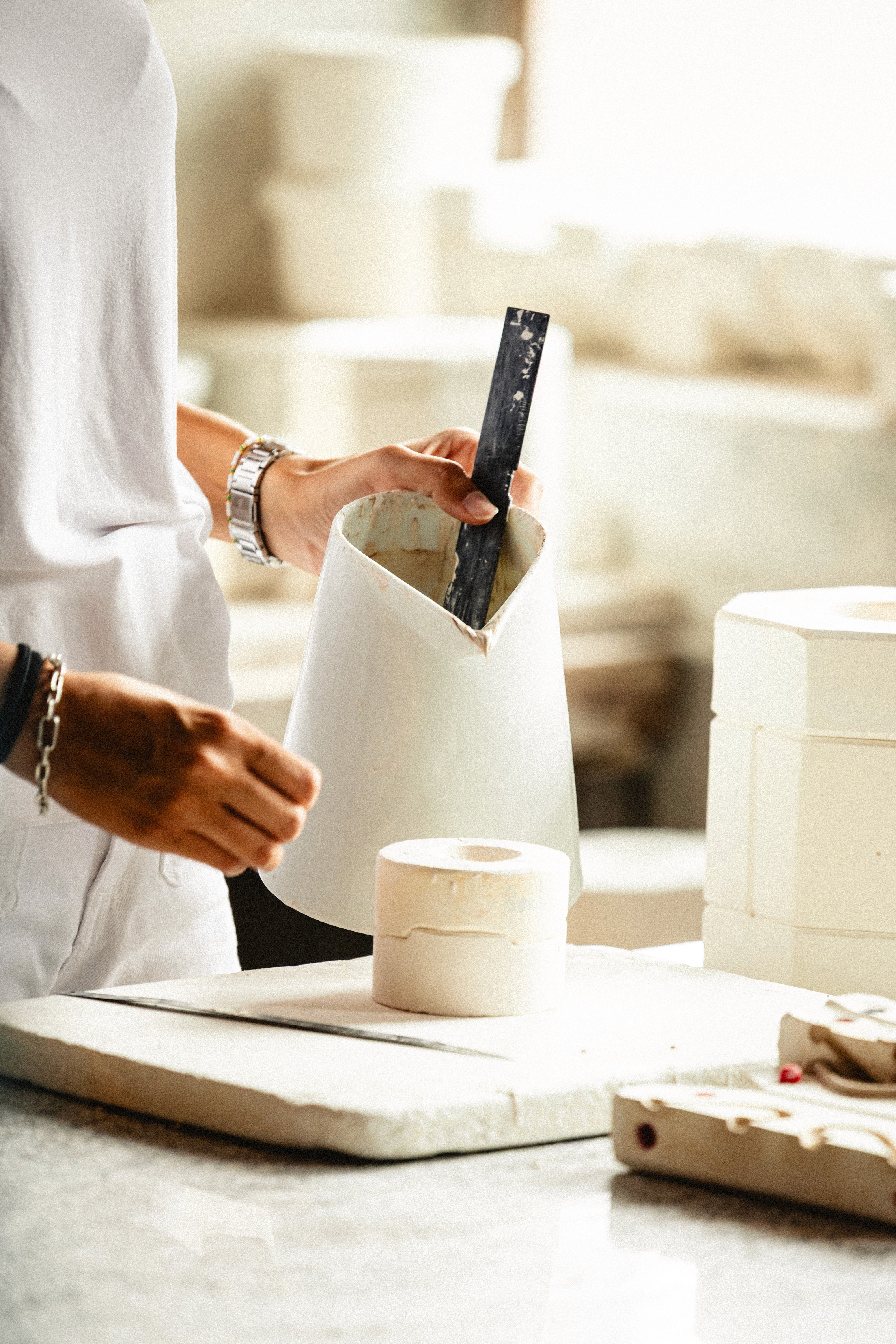 Woman in red light with hand on chest