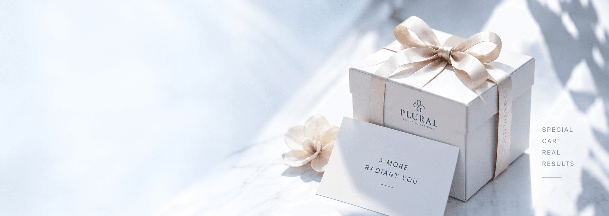 Gift box with white flowers on marble