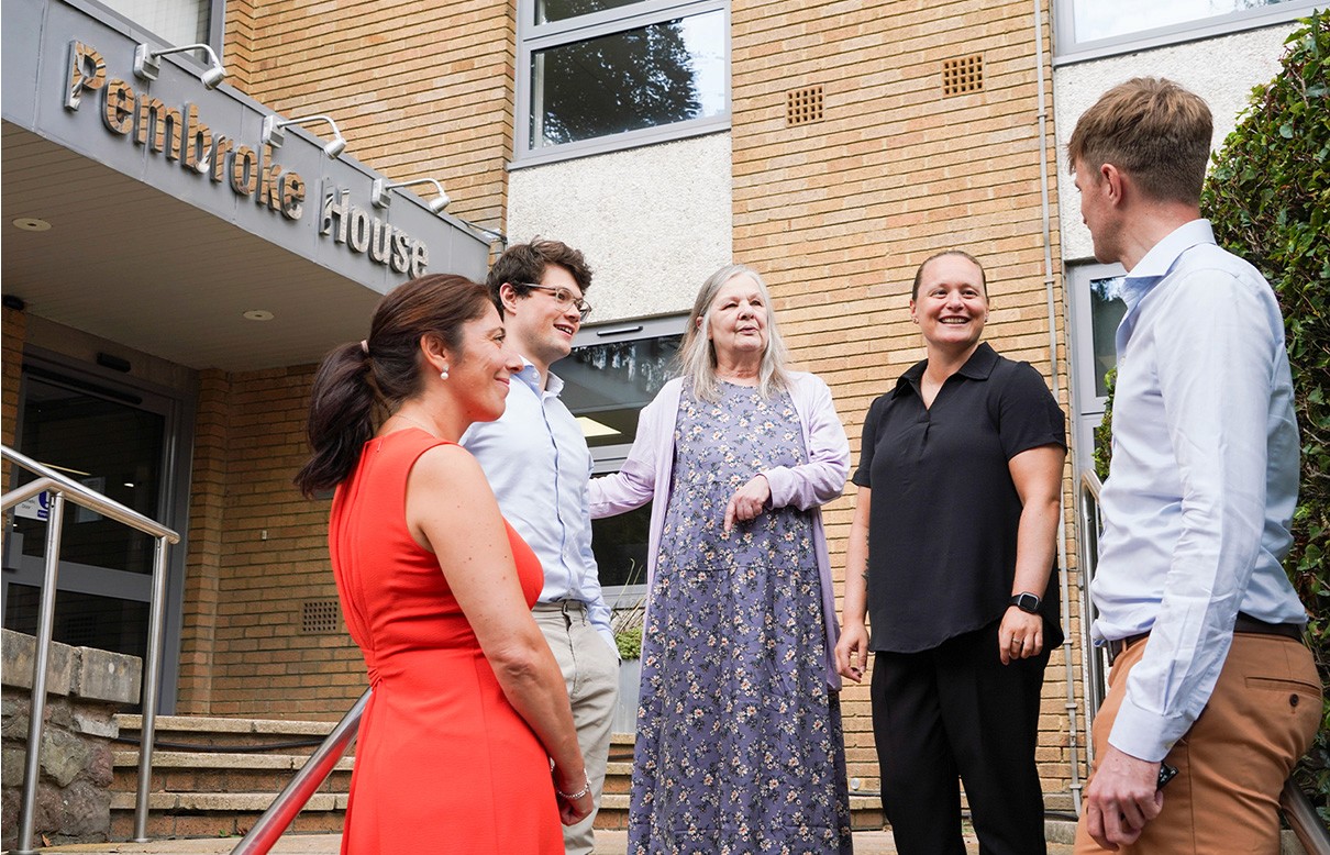 Hughes Price Walker team members standing outside the office, representing the company’s collaborative workplace culture.