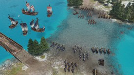 Screenshot du jeu PC Age of Empires IV sur Steam montrant une bataille stratégique entre factions rouges et bleues sur terre et mer. Navires à voiles, pont en bois, environnement hivernal et formations militaires.
