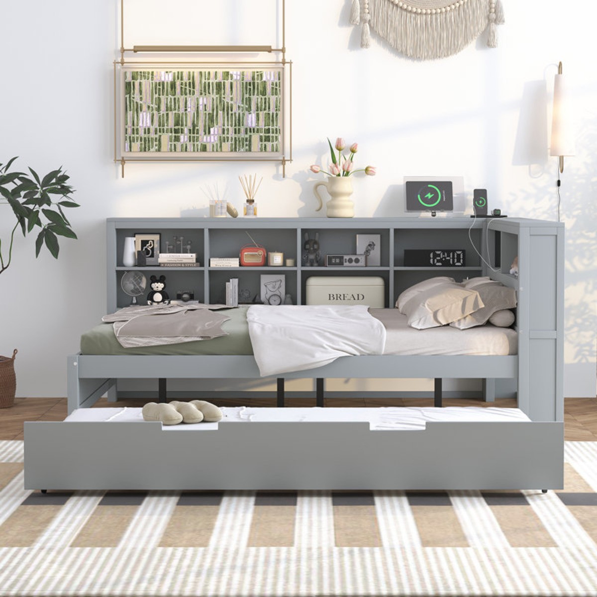 Wooden gray trundle bed with bookshelf storage.