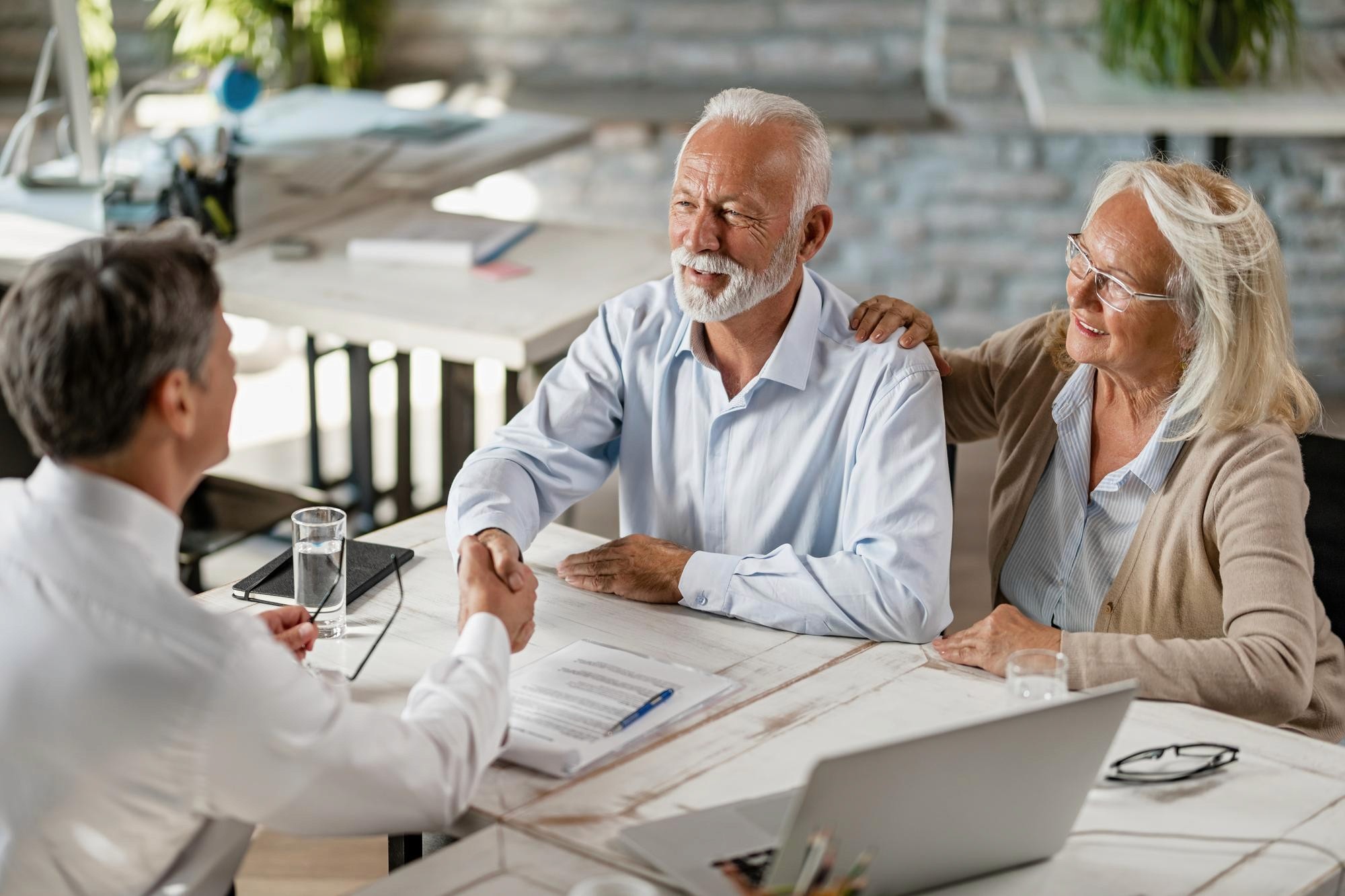 senior couple talking to mortgage broker regarding smsf