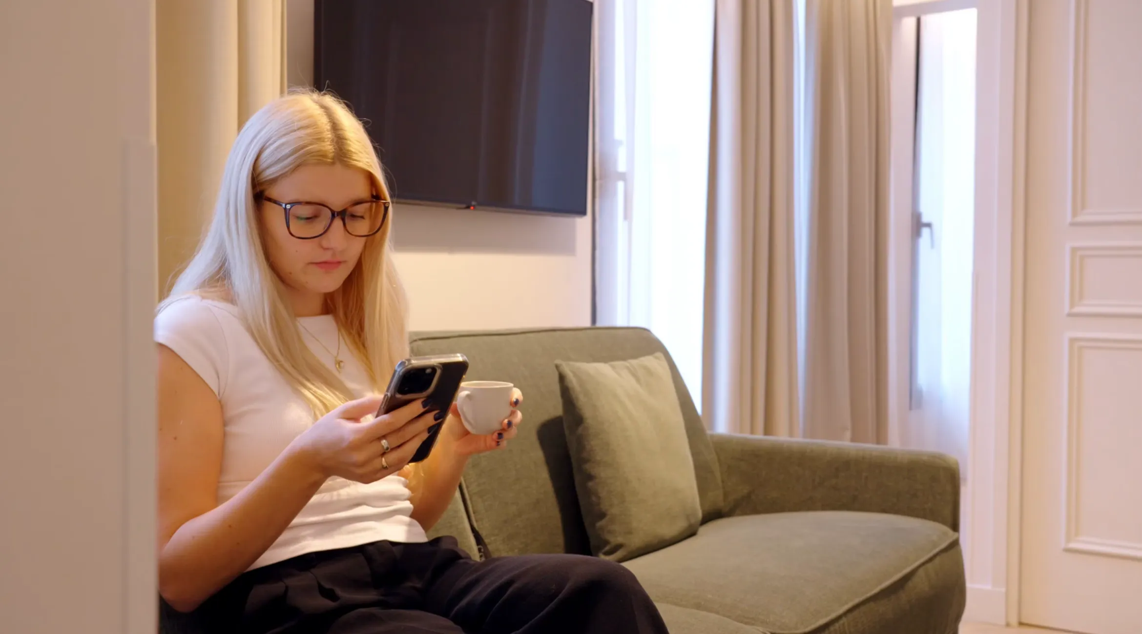 Young Female Guest on Phone using Boarding Pass