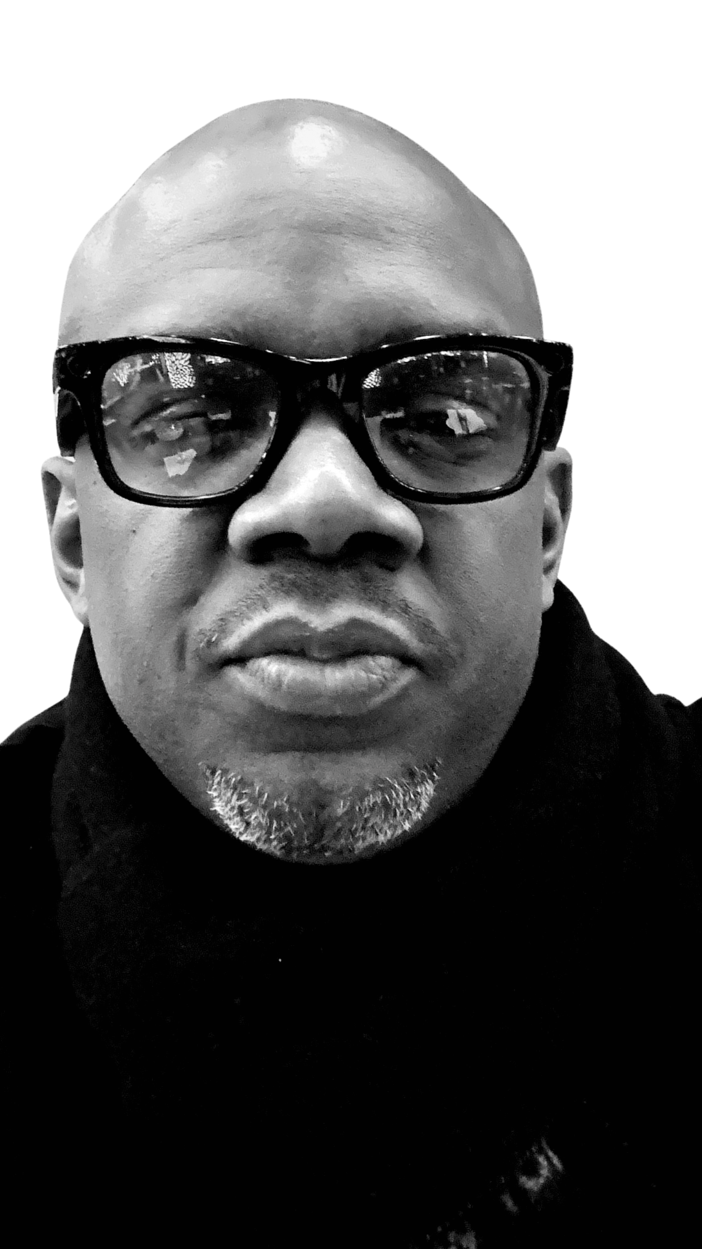 Profile portrait of a man in a white shirt against a light background