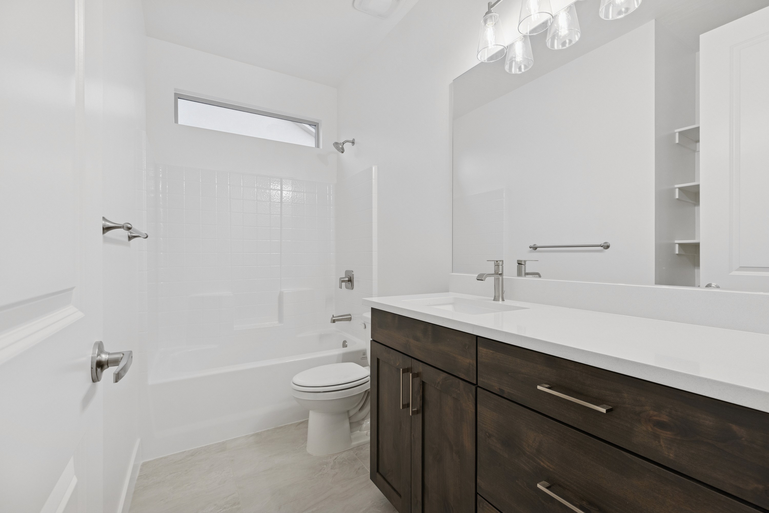 Bathroom in The High Desert Home featuring tub/shower insert and clean, modern finishes in Hurricane Utah.