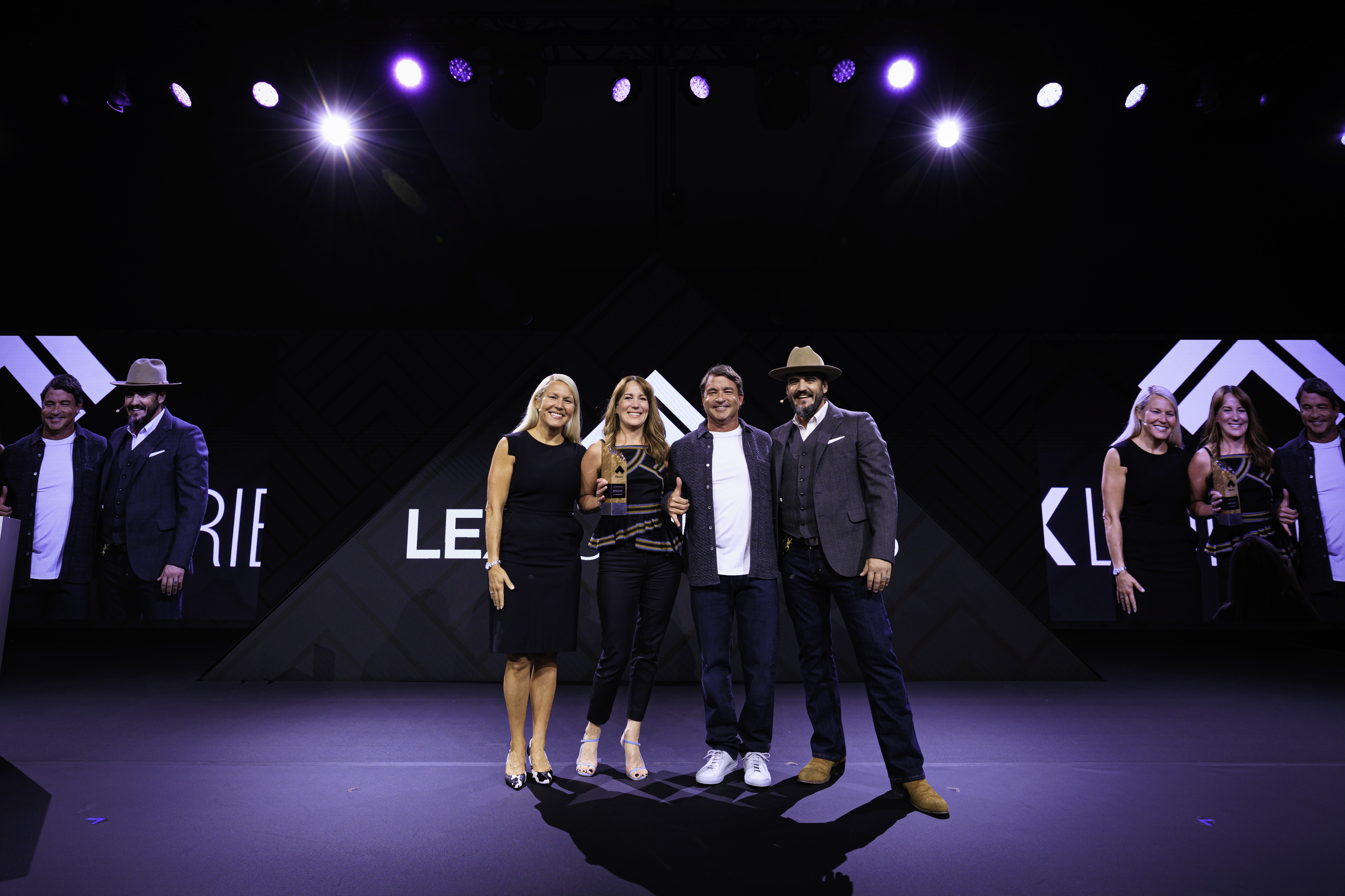 todd burnham taking award at lex summit 2024